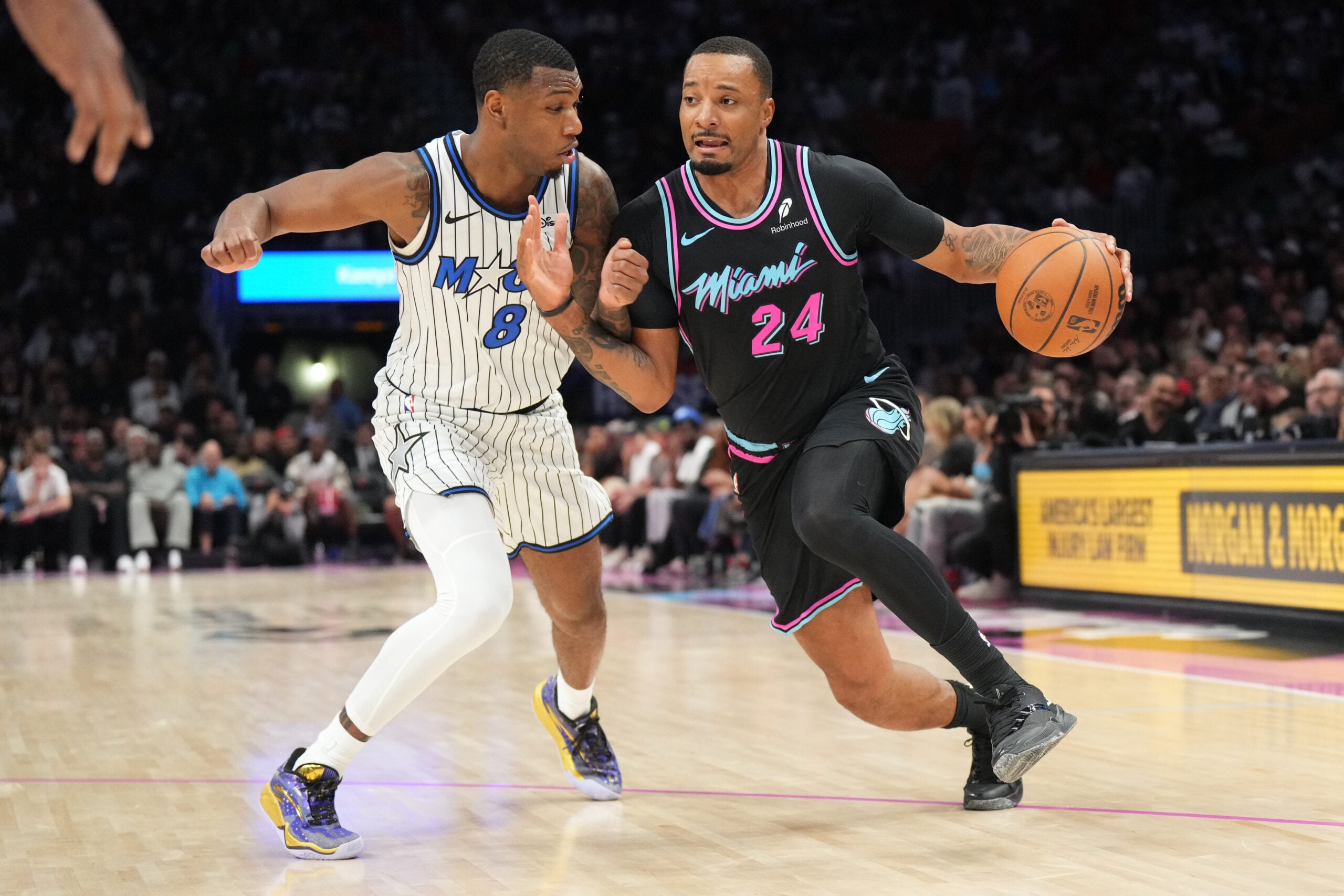 Mar 14, 2026; Miami, Florida, USA; Miami Heat guard Norman Powell (24) drives to the basket as Orlando Magic forward Jamal Cain (8) defends during the second half at Kaseya Center. Mandatory Credit: Jim Rassol-Imagn Images