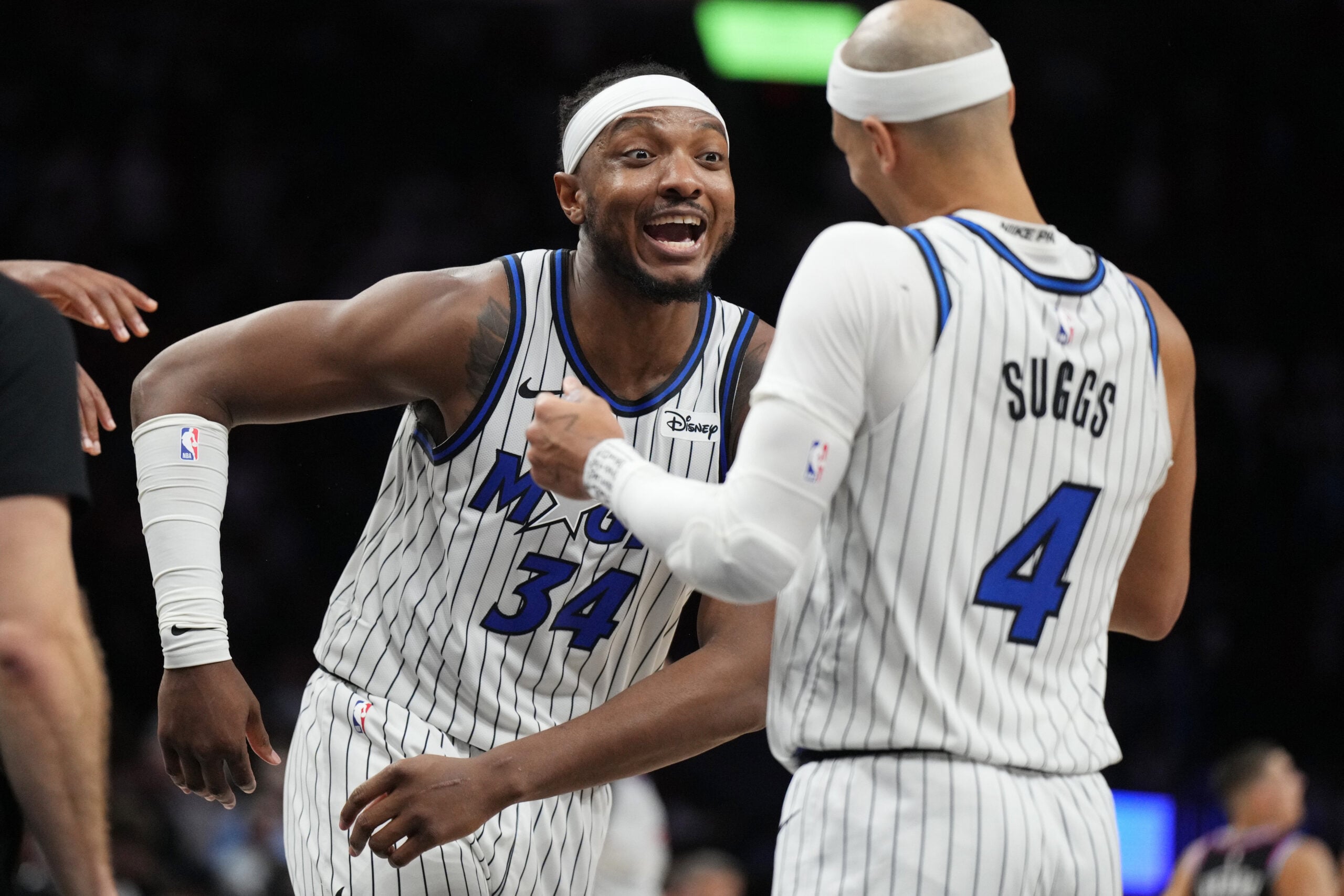 Mar 14, 2026; Miami, Florida, USA;  Orlando Magic guard Jalen Suggs (4) and center Wendell Carter Jr. (34) celebrate a win over the Miami Heat at Kaseya Center. Mandatory Credit: Jim Rassol-Imagn Images