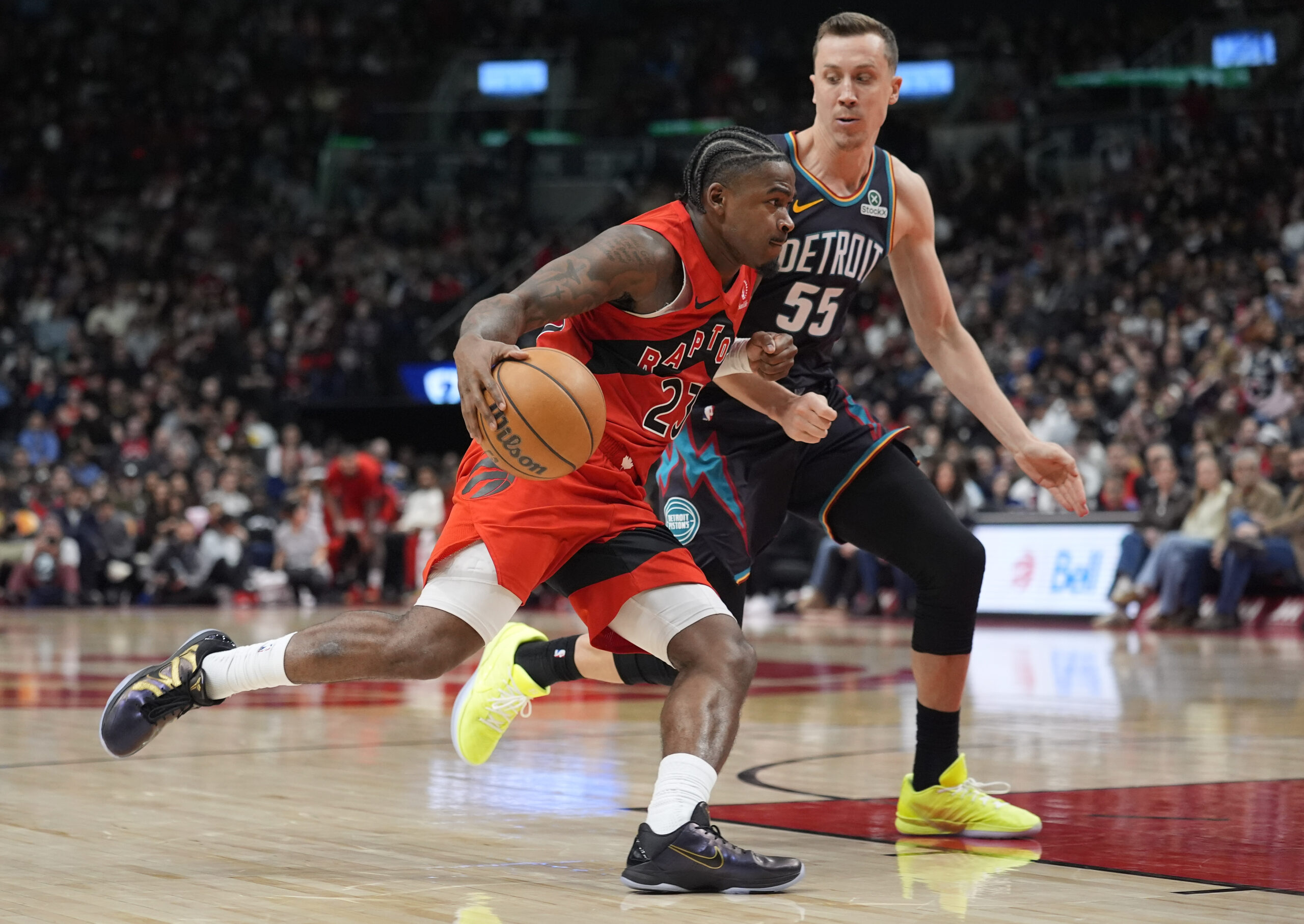 Mar 15, 2026; Toronto, Ontario, CAN; Toronto Raptors guard Jamal Shead (23) drives the the basket against Detroit Pistons guard Duncan Robinson (55) during the second half at Scotiabank Arena. Mandatory Credit: John E. Sokolowski-Imagn Images