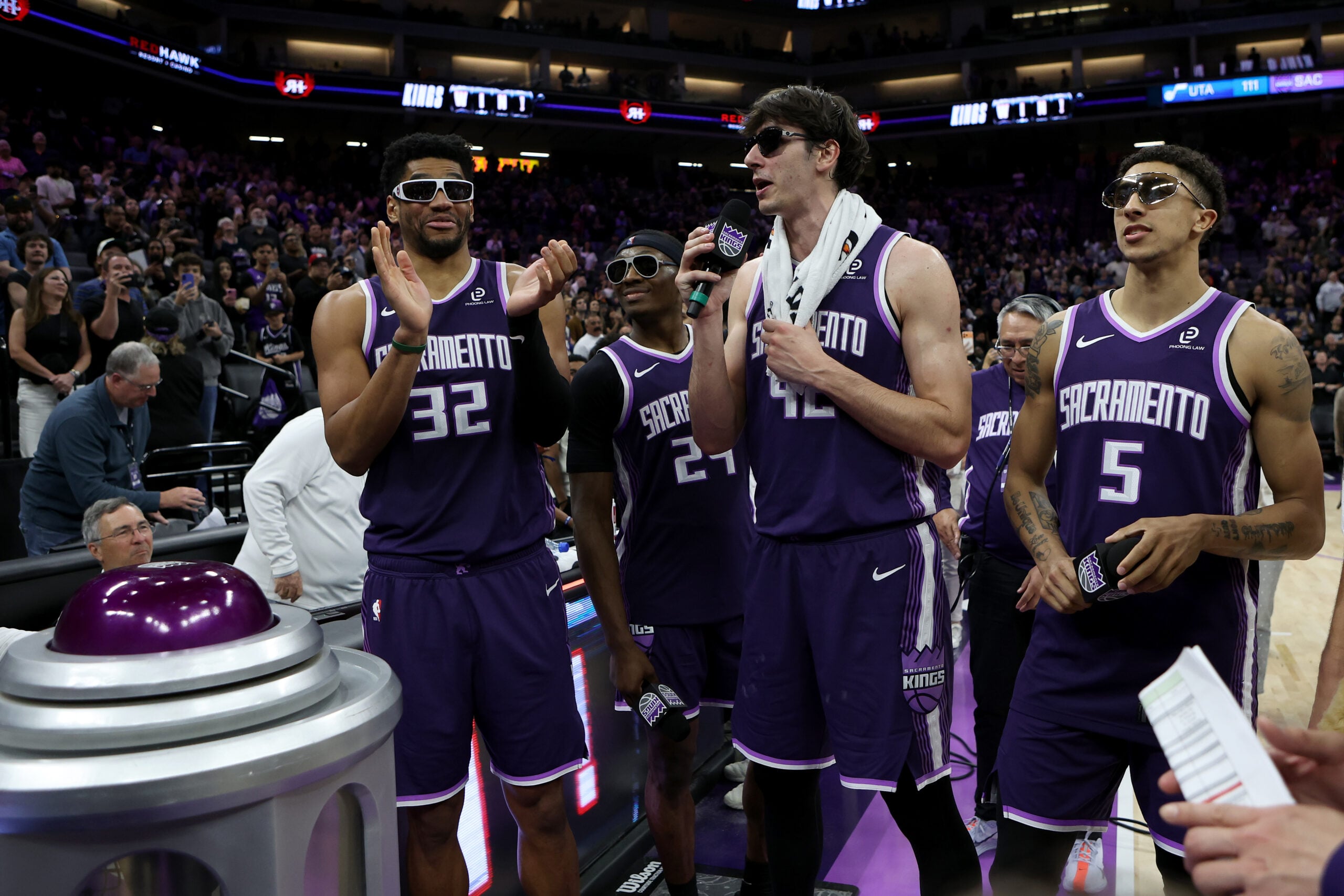 Mar 15, 2026; Sacramento, California, USA; Sacramento Kings Dylan Cardwell (32), Daeqwon Plowden (29), Maxine Raynaud (42), and Nique Clifford (5) pump up the crowd before lighting the beam after defeating the Utah Jazz at Golden 1 Center. Mandatory Credit: Dennis Lee-Imagn Images