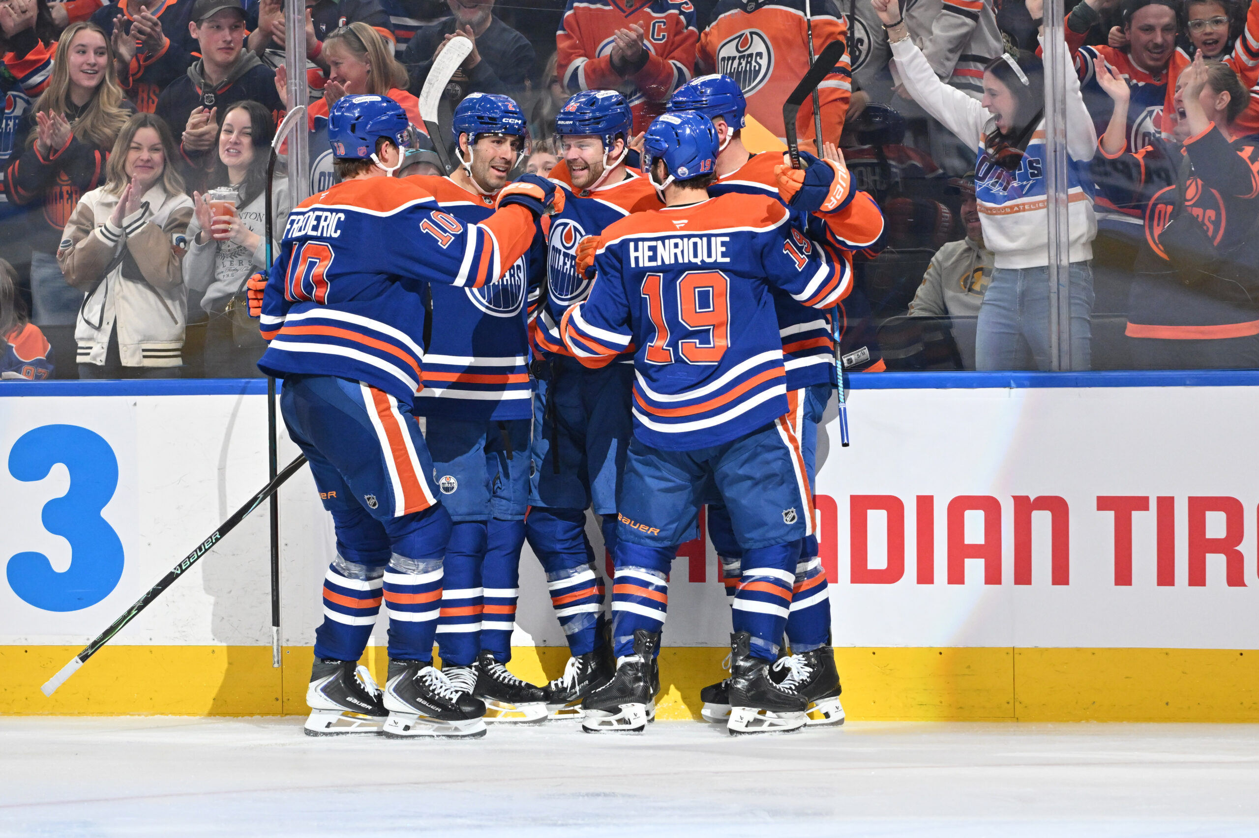 Mar 17, 2026; Edmonton, Alberta, CAN; Edmonton Oilers center Trent Frederic (10) with defenseman Evan Bouchard (2) left winger Max Jones (46) and center Adam Henrique (19) celebrate a goal on San Jose Sharks goalie Alex Nedeljkovic (33) (not pictured) during the third period at Rogers Place. Mandatory Credit: Walter Tychnowicz-Imagn Images