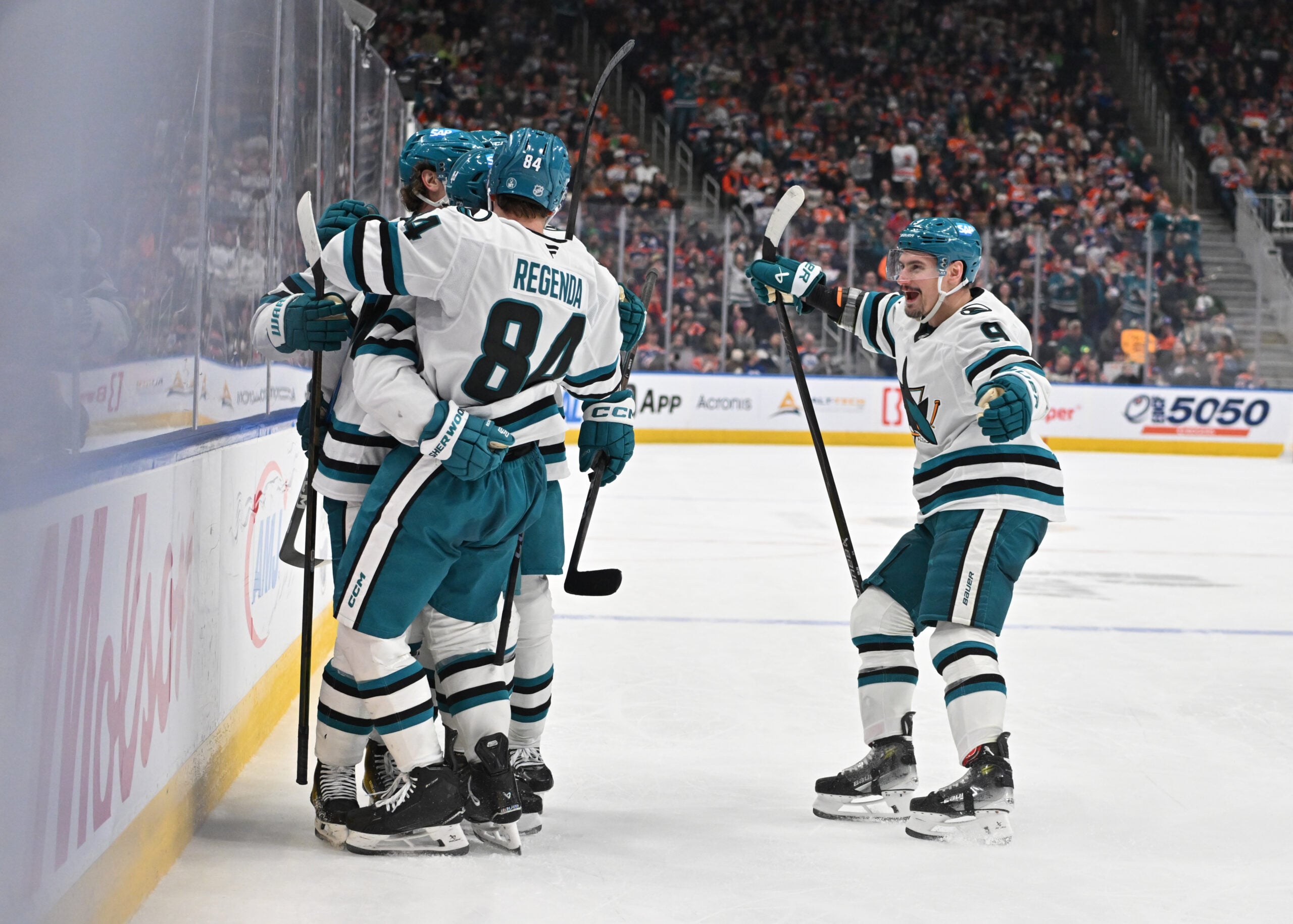 Mar 17, 2026; Edmonton, Alberta, CAN; San Jose Sharks left winger Pavol Regenda (84) with defenseman Dmitry Orlov (9) celebrate a goal on Edmonton Oilers goalie Connor Ingram (39) (not pictured) during the second period at Rogers Place. Mandatory Credit: Walter Tychnowicz-Imagn Images