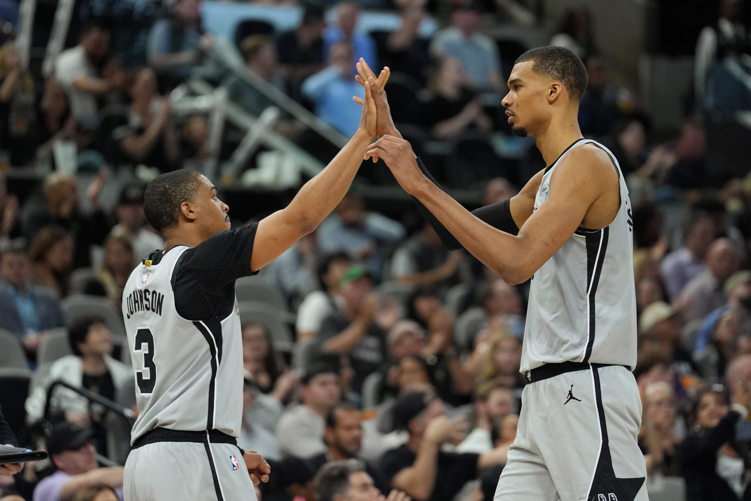 Mar 19, 2026; San Antonio, Texas, USA; San Antonio Spurs forwards Keldon Johnson (3) and Victor Wembanyama (1) celebrate in the second half against the Phoenix Suns at Frost Bank Center. Mandatory Credit: Daniel Dunn-Imagn Images