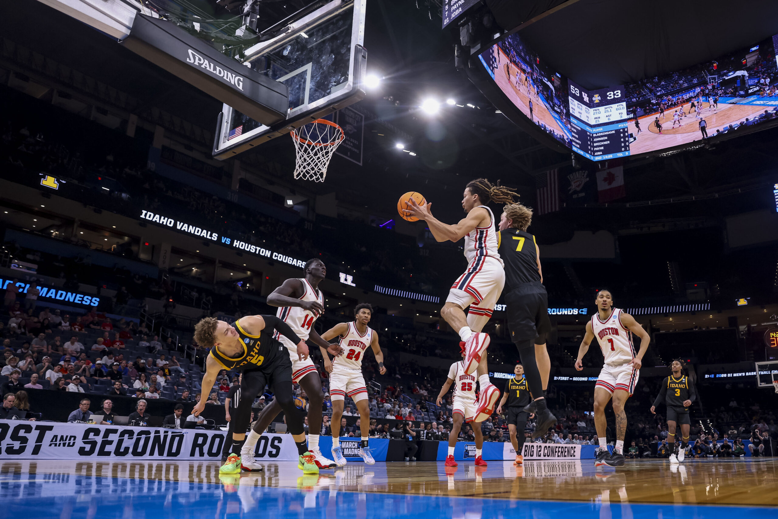 Mar 19, 2026; Oklahoma City, OK, USA; Houston Cougars guard Kingston Flemings (4) attempts a layup during a first round game of the men's 2026 NCAA Tournament at Paycom Center. Mandatory Credit: William Purnell-Imagn Images