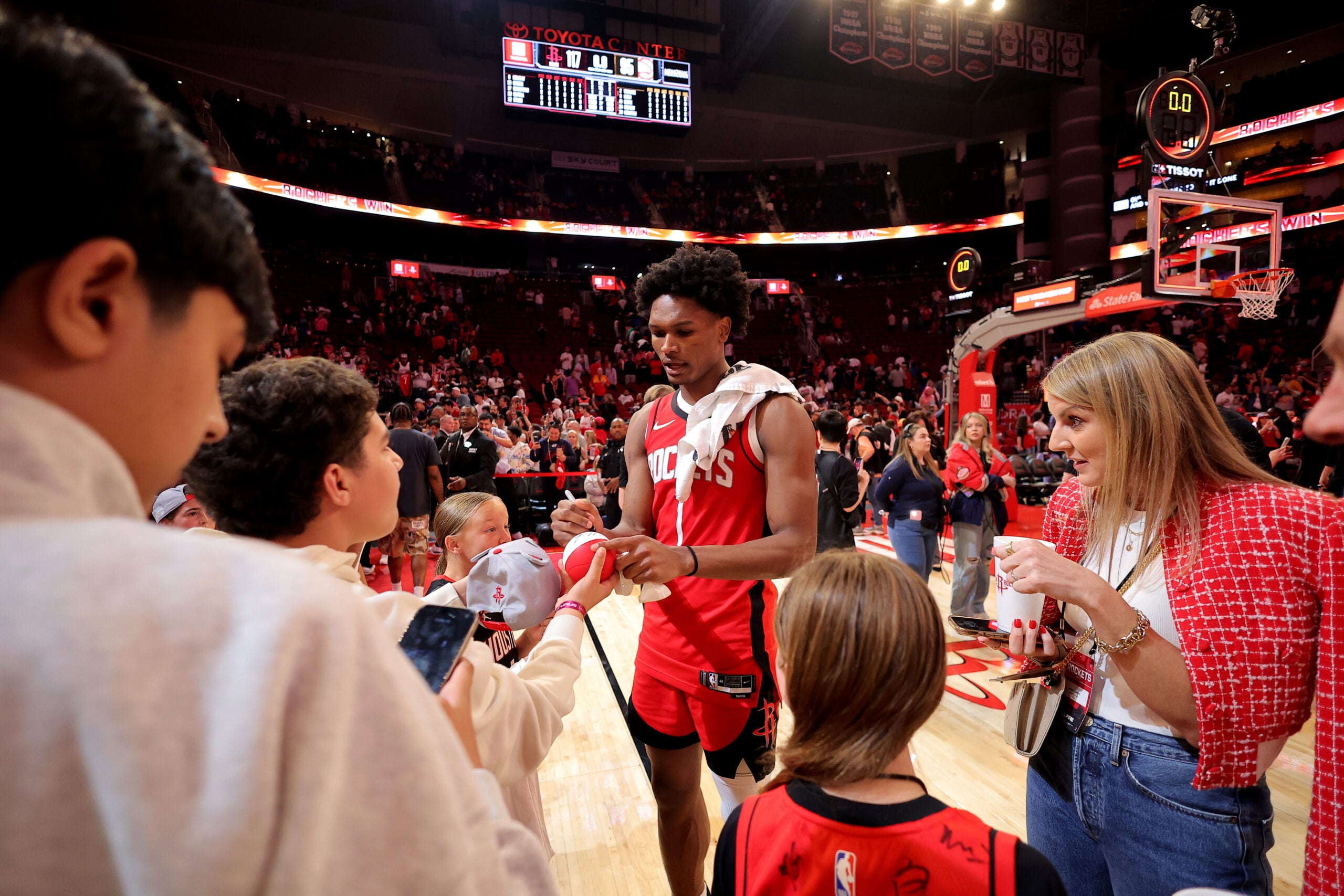 Mar 20, 2026; Houston, Texas, USA; Houston Rockets guard Amen Thompson (1) signs autographs for fans following the game against the Atlanta Hawks at Toyota Center. Mandatory Credit: Erik Williams-Imagn Images