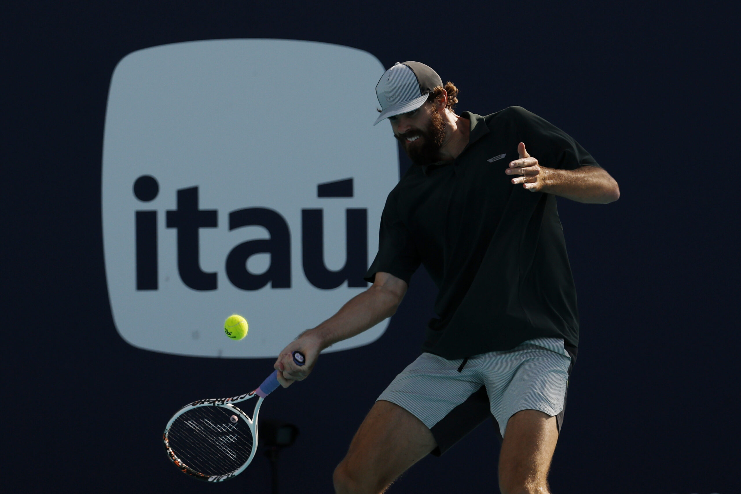 Mar 20, 2026; Miami Gardens, FL, USA; Reilly Opelka (USA) hits a forehand against Jack Draper (GBR) (not pictured) on day four of the 2026 Miami Open at Hard Rock Stadium. Mandatory Credit: Geoff Burke-Imagn Images