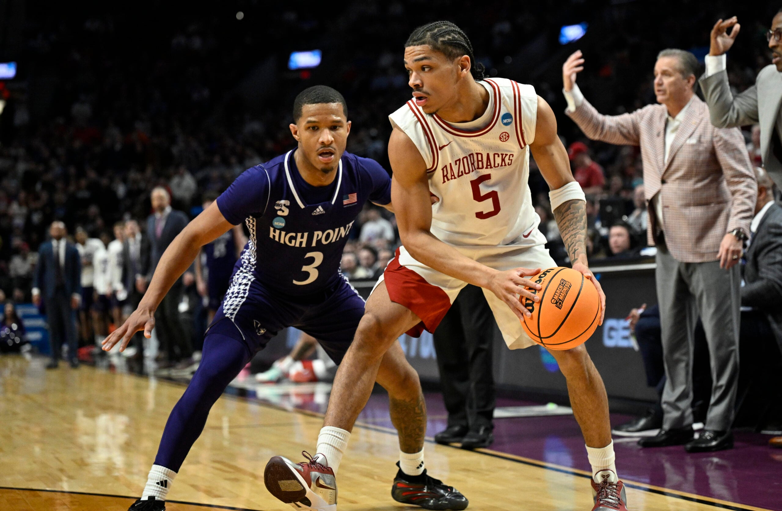 Mar 21, 2026; Portland, OR, USA; Arkansas Razorbacks guard Darius Acuff Jr. (5) drives against High Point Panthers guard Rob Martin (3) in the second half during a second round game of the men's 2026 NCAA Tournament at Moda Center. Mandatory Credit: Troy Wayrynen-Imagn Images