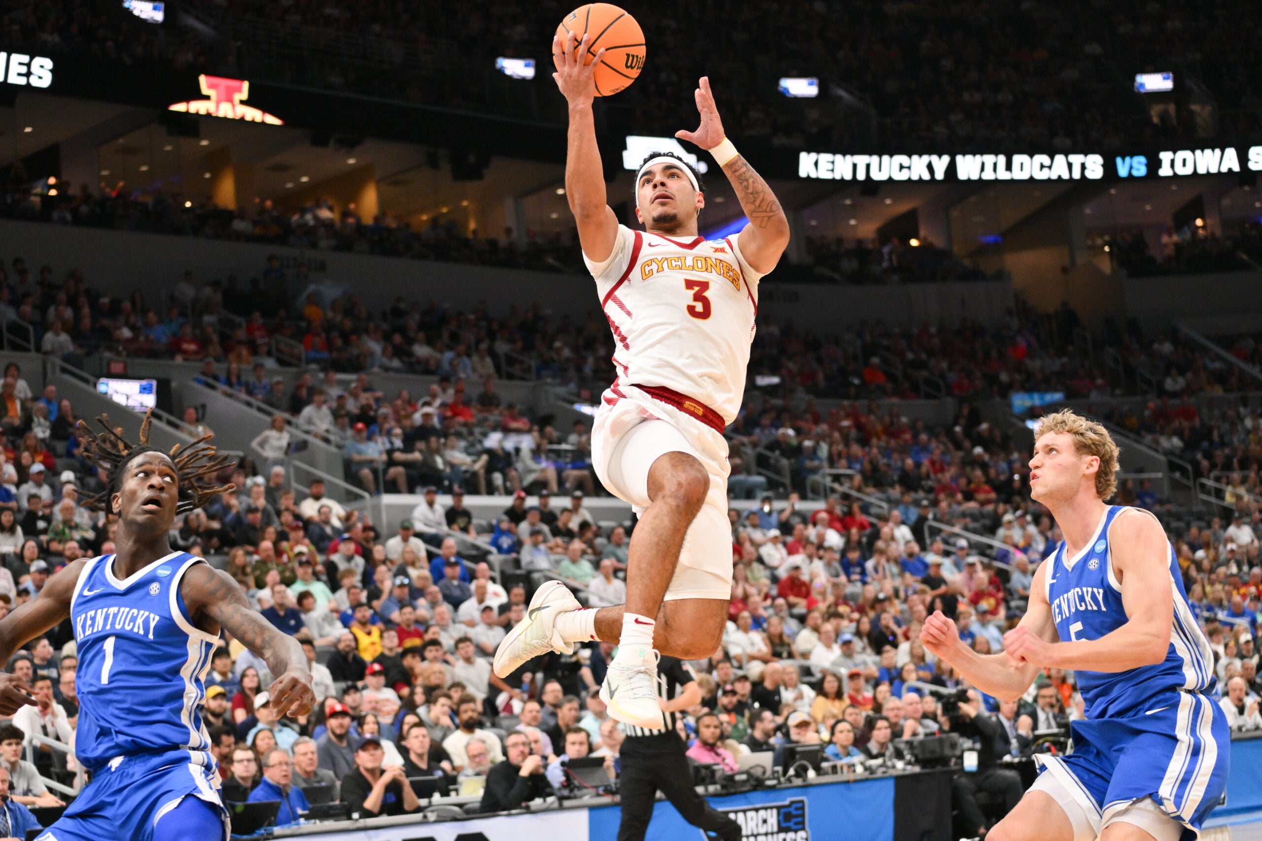 Mar 22, 2026; St. Louis, MO, USA; Iowa State Cyclones guard Tamin Lipsey (3) drives to the basket for a lay up as Kentucky Wildcats guard Collin Chandler (5) defends during the first half during a second round game of the men's 2026 NCAA Tournament at Enterprise Center. Mandatory Credit: Jeff Curry-Imagn Images