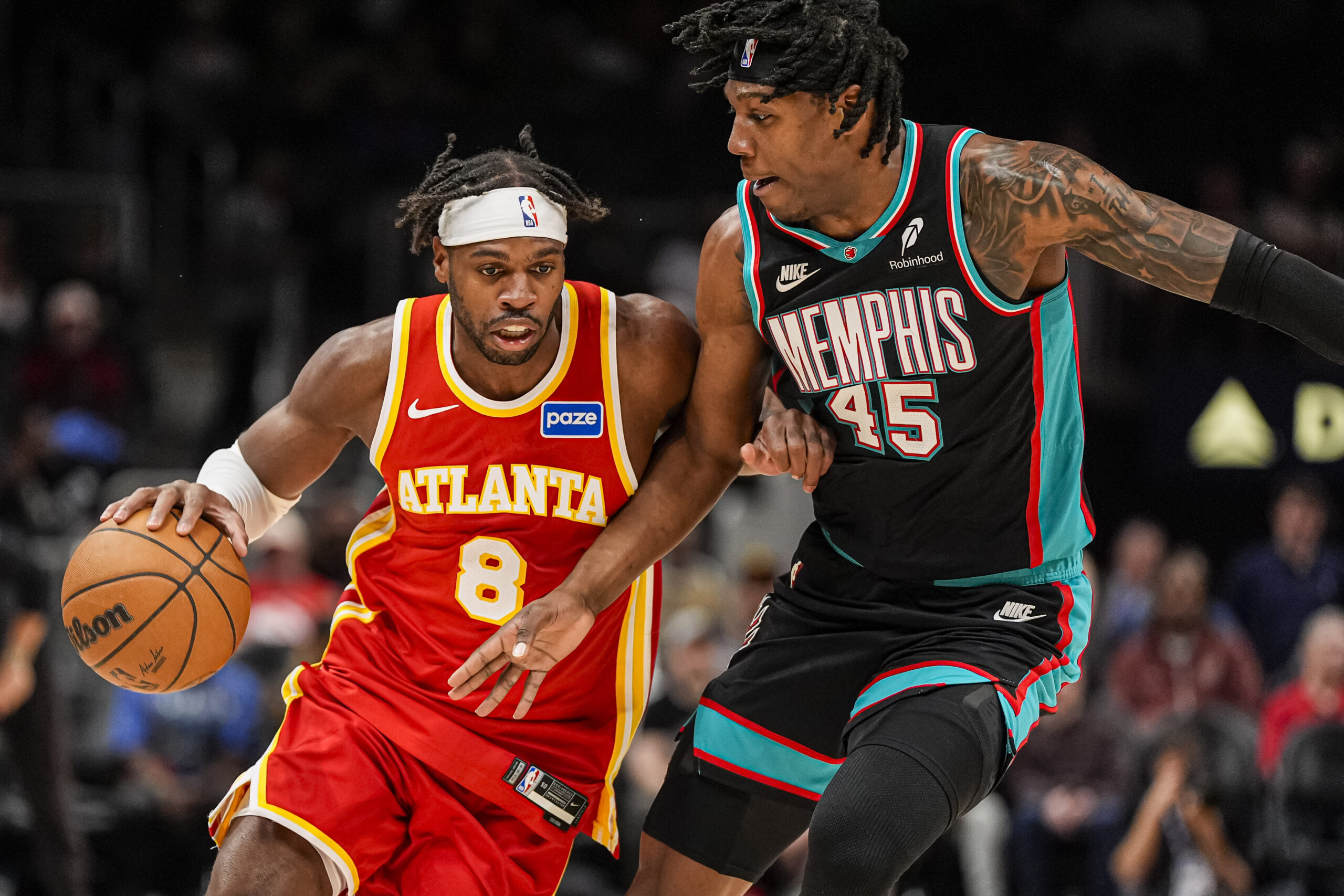 Mar 23, 2026; Atlanta, Georgia, USA; Atlanta Hawks guard Buddy Hield (8) dribbles against Memphis Grizzlies forward GG Jackson (45) during the second half at State Farm Arena. Mandatory Credit: Dale Zanine-Imagn Images