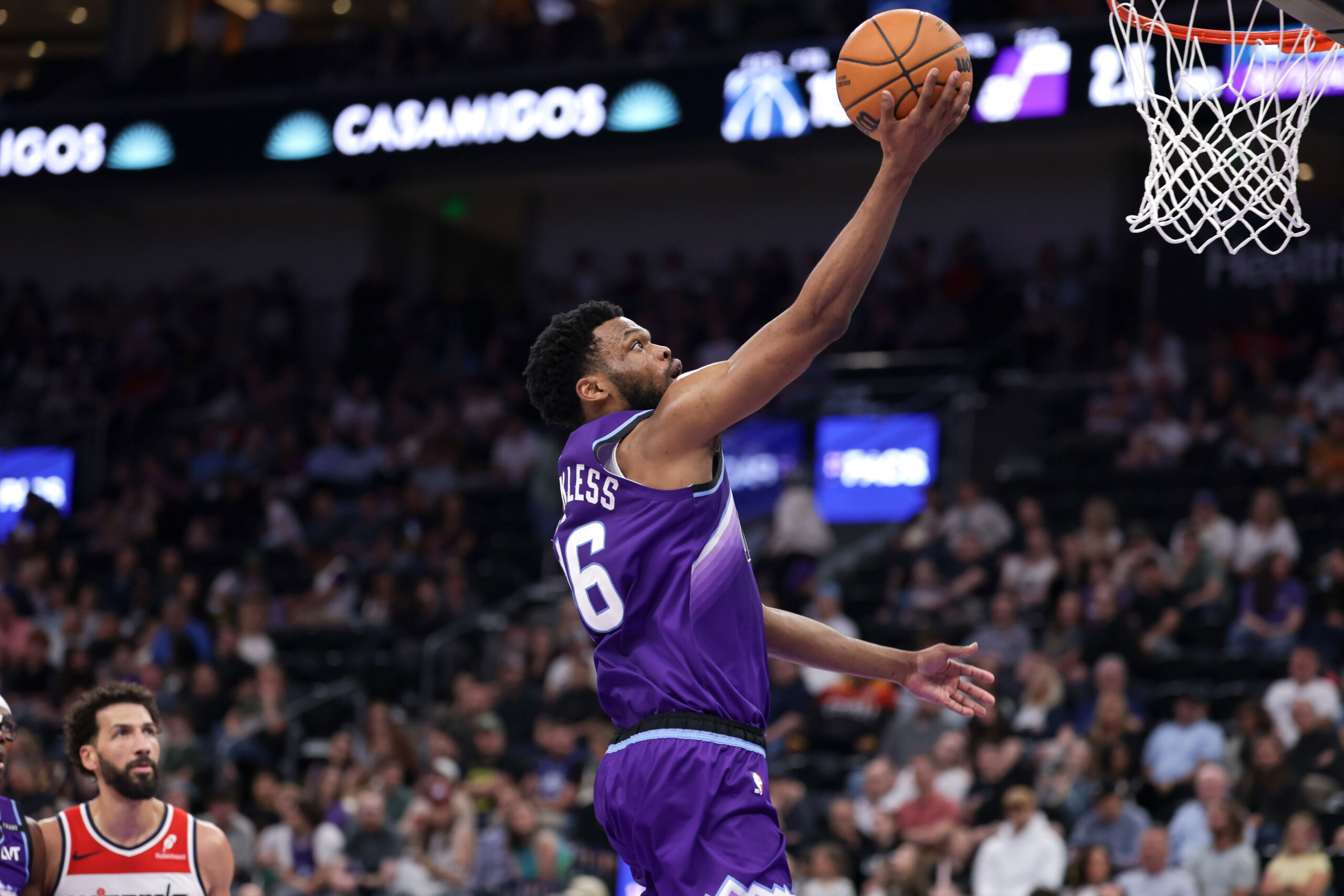 Mar 25, 2026; Salt Lake City, Utah, USA;  Utah Jazz guard Elijah Harkless (16) puts the ball in the basket during the second half against the Washington Wizards at Delta Center. Mandatory Credit: Chris Nicoll-Imagn Images