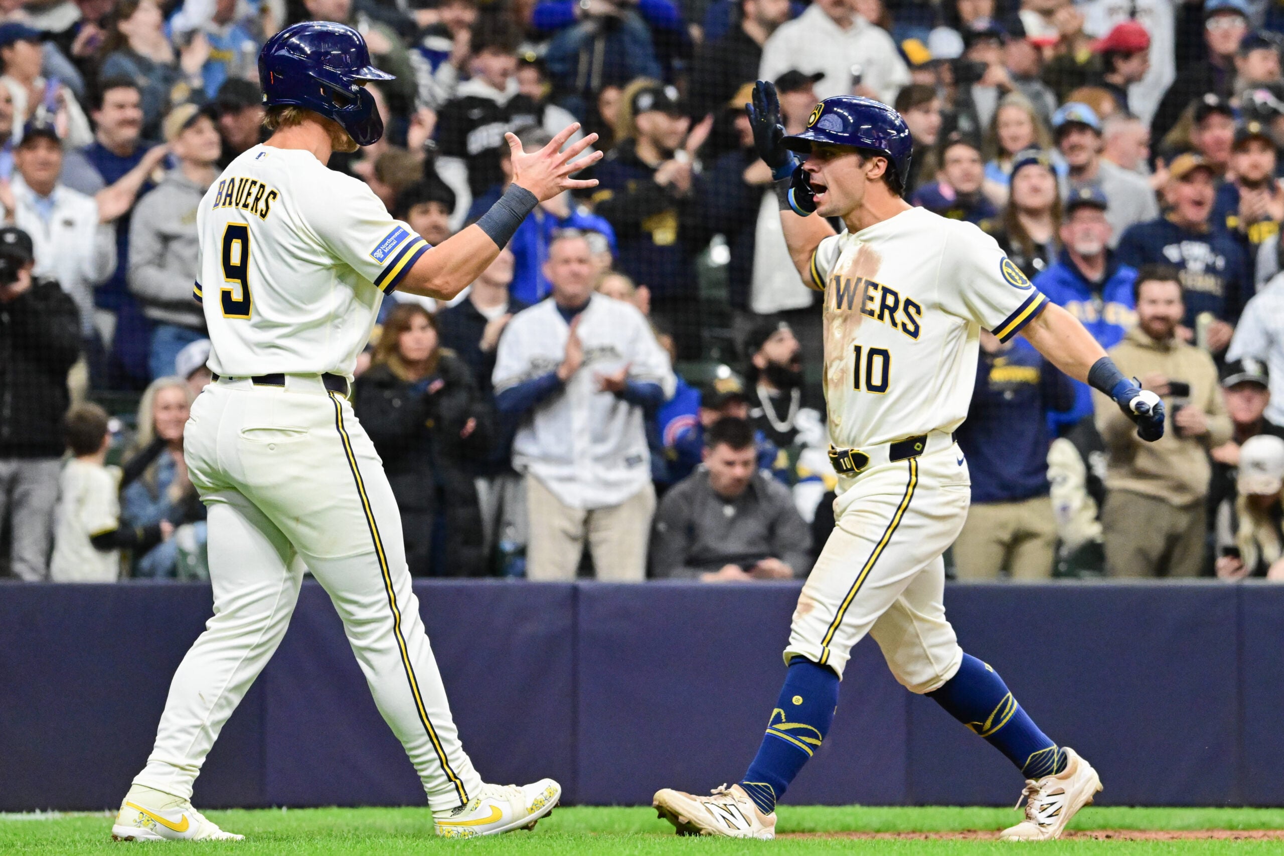 Mar 26, 2026; Milwaukee, Wisconsin, USA; Milwaukee Brewers right fielder Sal Frelick (10) is greeted by left fielder Jake Bauers (9) after hitting a two-run home run in the fifth inning at American Family Field. Mandatory Credit: Benny Sieu-Imagn Images