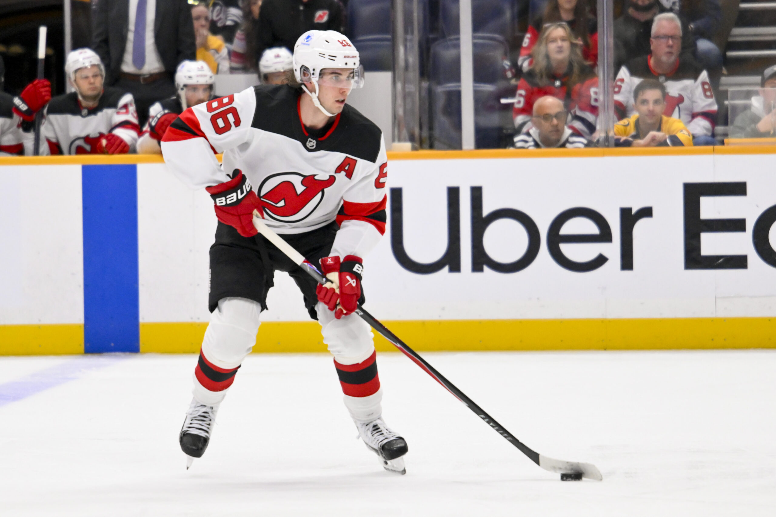 Mar 26, 2026; Nashville, Tennessee, USA;  New Jersey Devils center Jack Hughes (86) skates with the puck against the New Jersey Devils during the second period at Bridgestone Arena. Mandatory Credit: Steve Roberts-Imagn Images