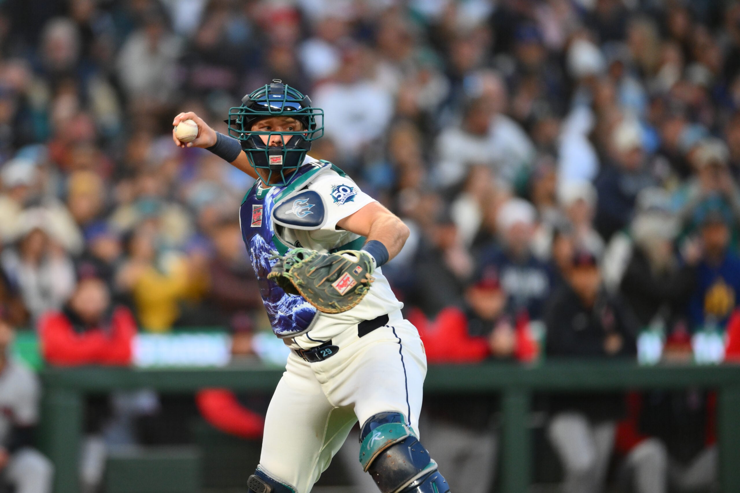 Mar 26, 2026; Seattle, Washington, USA; Seattle Mariners catcher Cal Raleigh (29) throws the ball to first base during the first inning against the Cleveland Guardians at T-Mobile Park. Mandatory Credit: Steven Bisig-Imagn Images