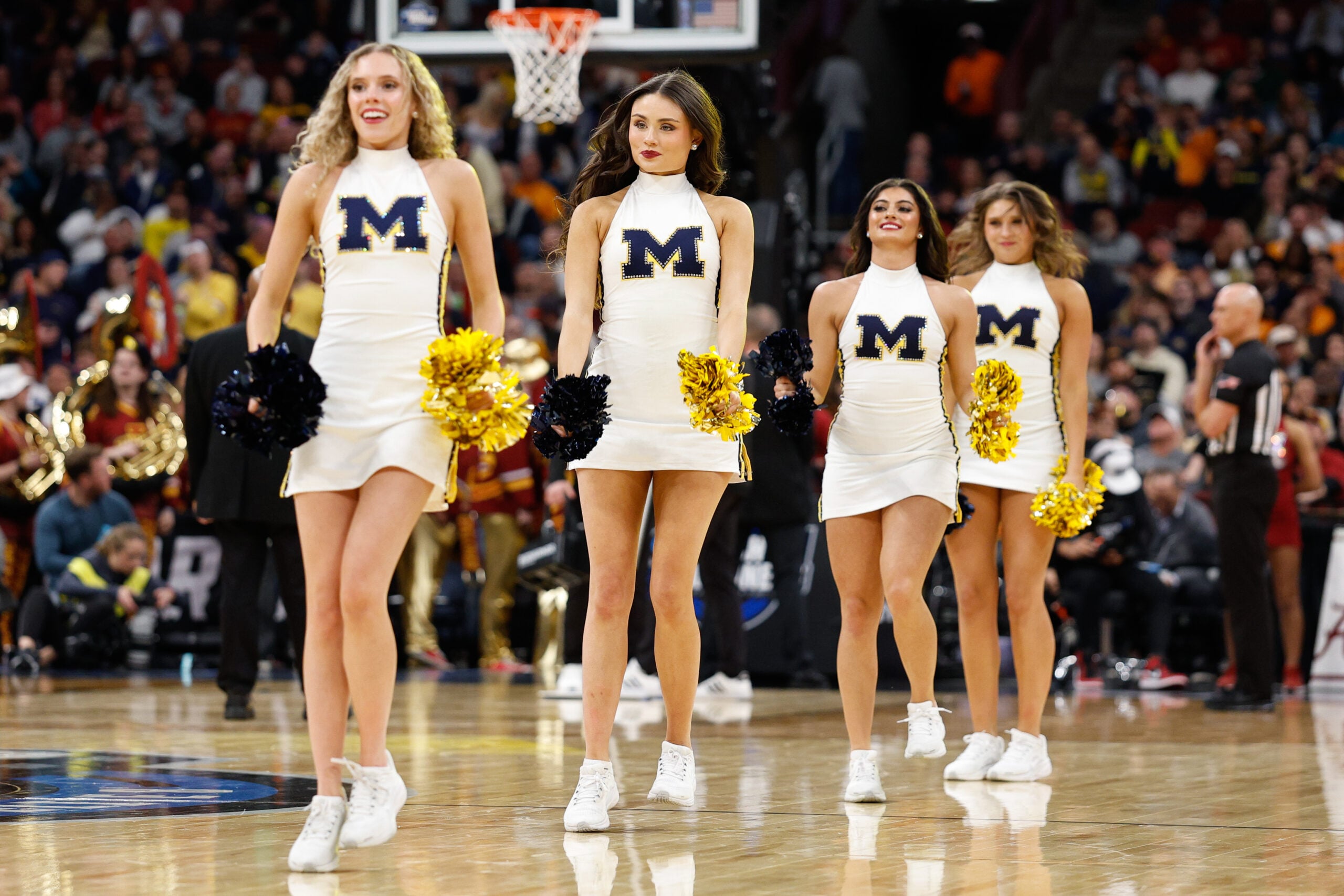 Mar 27, 2026; Chicago, IL, USA; Michigan Wolverines cheerleaders perform during the second half against the Alabama Crimson Tide during a Sweet Sixteen game of the Midwest Regional of the men's 2026 NCAA Tournament at United Center. Mandatory Credit: Kamil Krzaczynski-Imagn Images