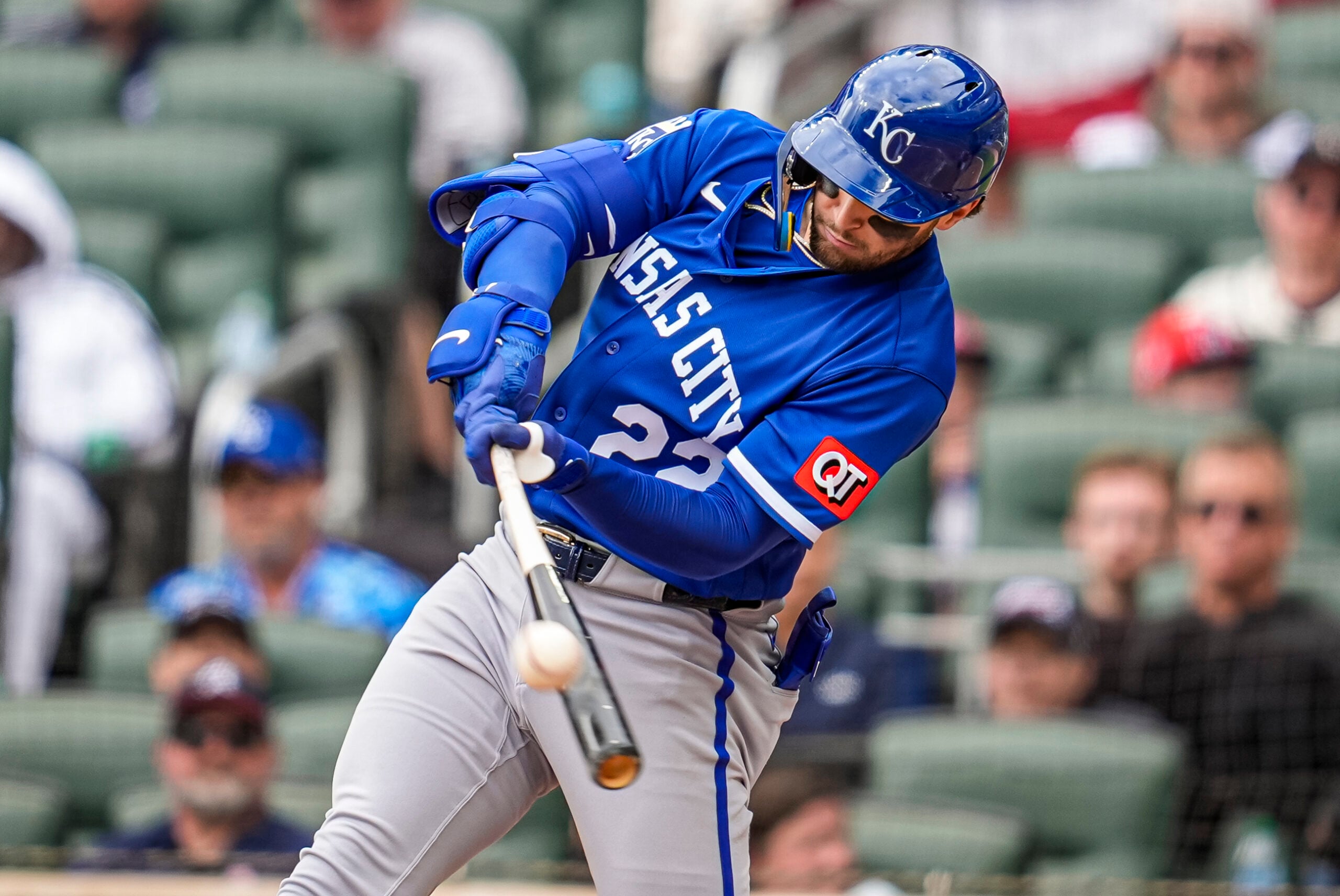 Mar 29, 2026; Cumberland, Georgia, USA; Kansas City Royals catcher Carter Jensen (22)  drives in a run with a sacrifice fly against the Atlanta Braves during the eighth inning at Truist Park. Mandatory Credit: Dale Zanine-Imagn Images