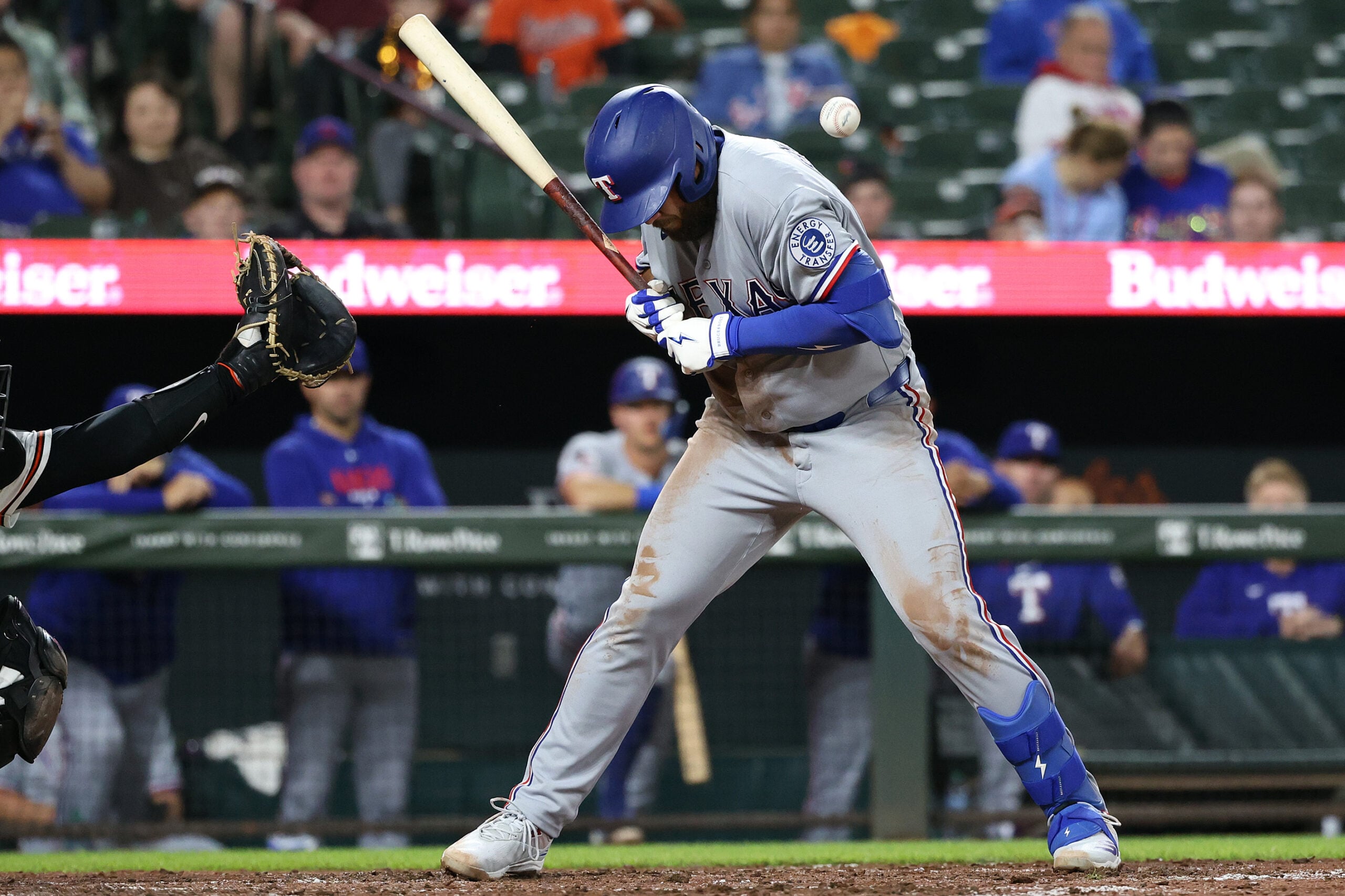 Mar 30, 2026; Baltimore, Maryland, USA; Texas Rangers first baseman Jake Burger (21) gets hit by a pitch during the fourth inning against the Baltimore Orioles at Oriole Park at Camden Yards. Mandatory Credit: Daniel Kucin Jr.-Imagn Images