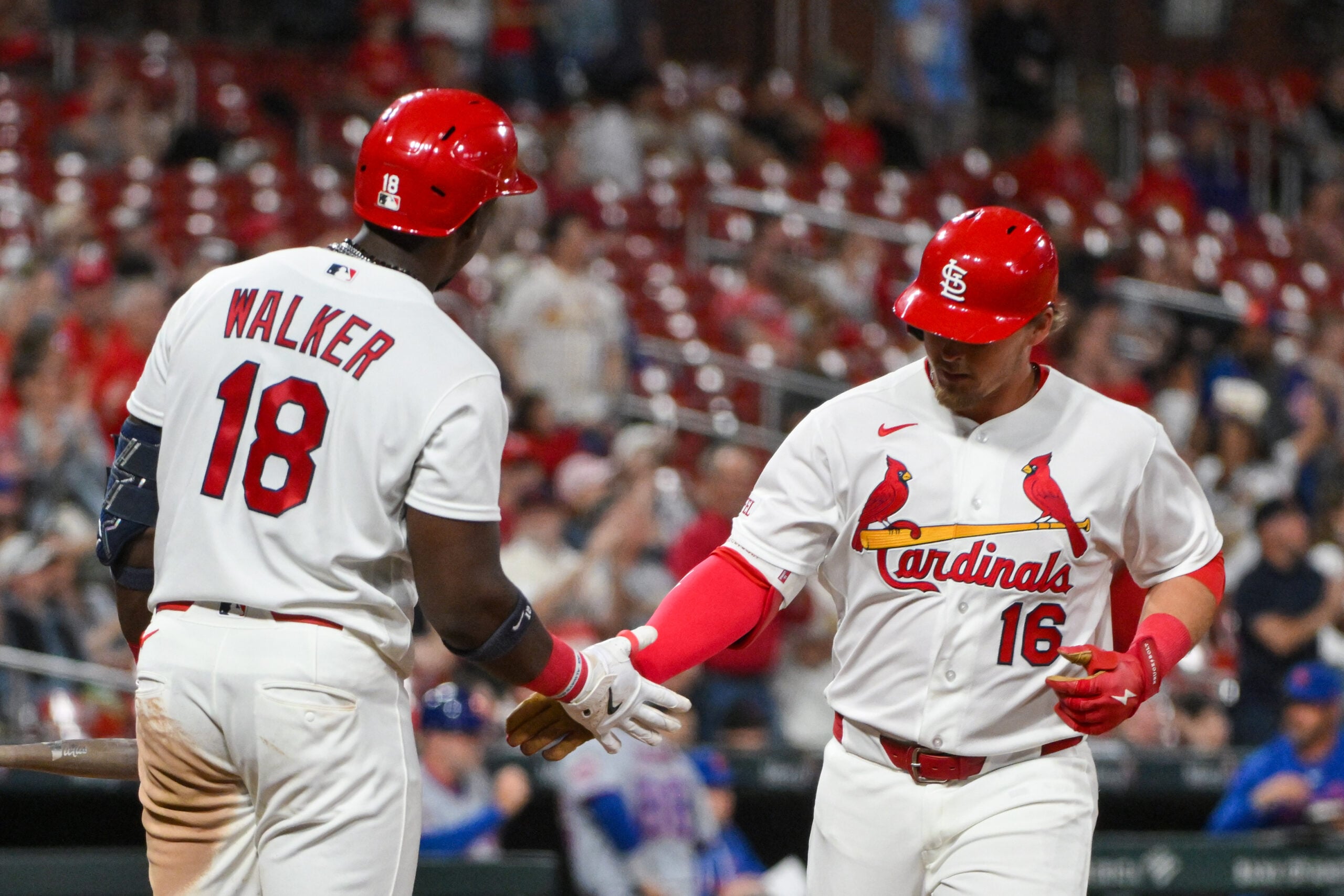 Mar 30, 2026; St. Louis, Missouri, USA; St. Louis Cardinals third baseman Nolan Gorman (16) is congratulated by right fielder Jordan Walker (18) after hitting a solo home run against the New York Mets during the sixth inning at Busch Stadium. Mandatory Credit: Jeff Curry-Imagn Images