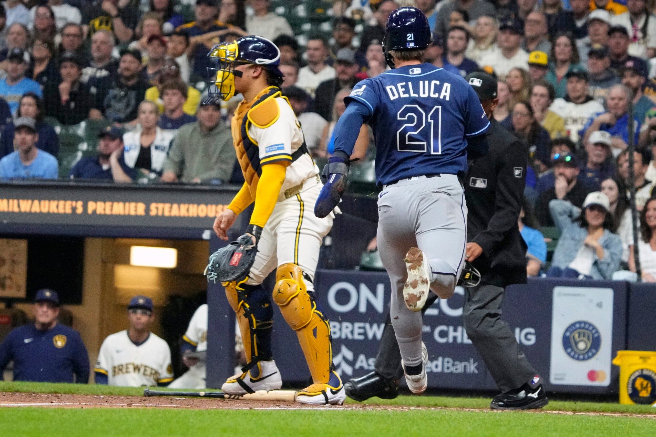 Mar 30, 2026; Milwaukee, Wisconsin, USA; Tampa Bay Rays center fielder Jonny DeLuca (21) scores from first base against the Milwaukee Brewers in the ninth inning at American Family Field. Mandatory Credit: Michael McLoone-Imagn Images