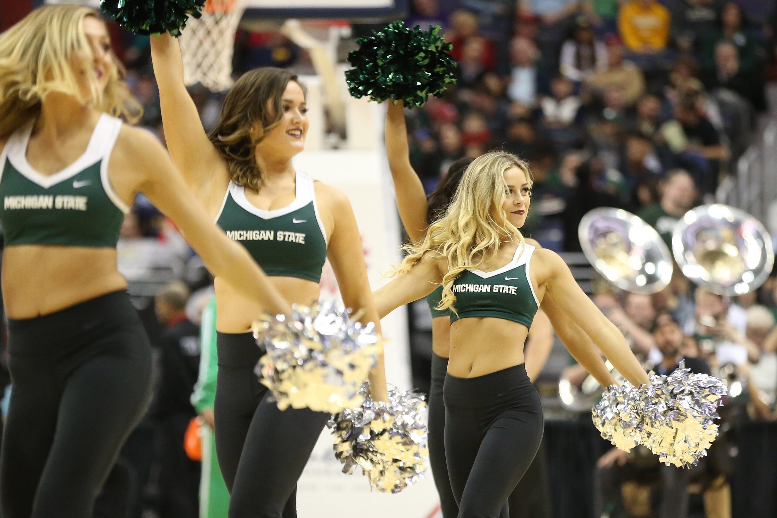 Mar 10, 2017; Washington, DC, USA; Michigan State Spartans cheerleaders perform on the court during a stoppage in play against the Minnesota Golden Gophers in the first half during the Big Ten Conference Tournament at Verizon Center. Mandatory Credit: Geoff Burke-Imagn Images