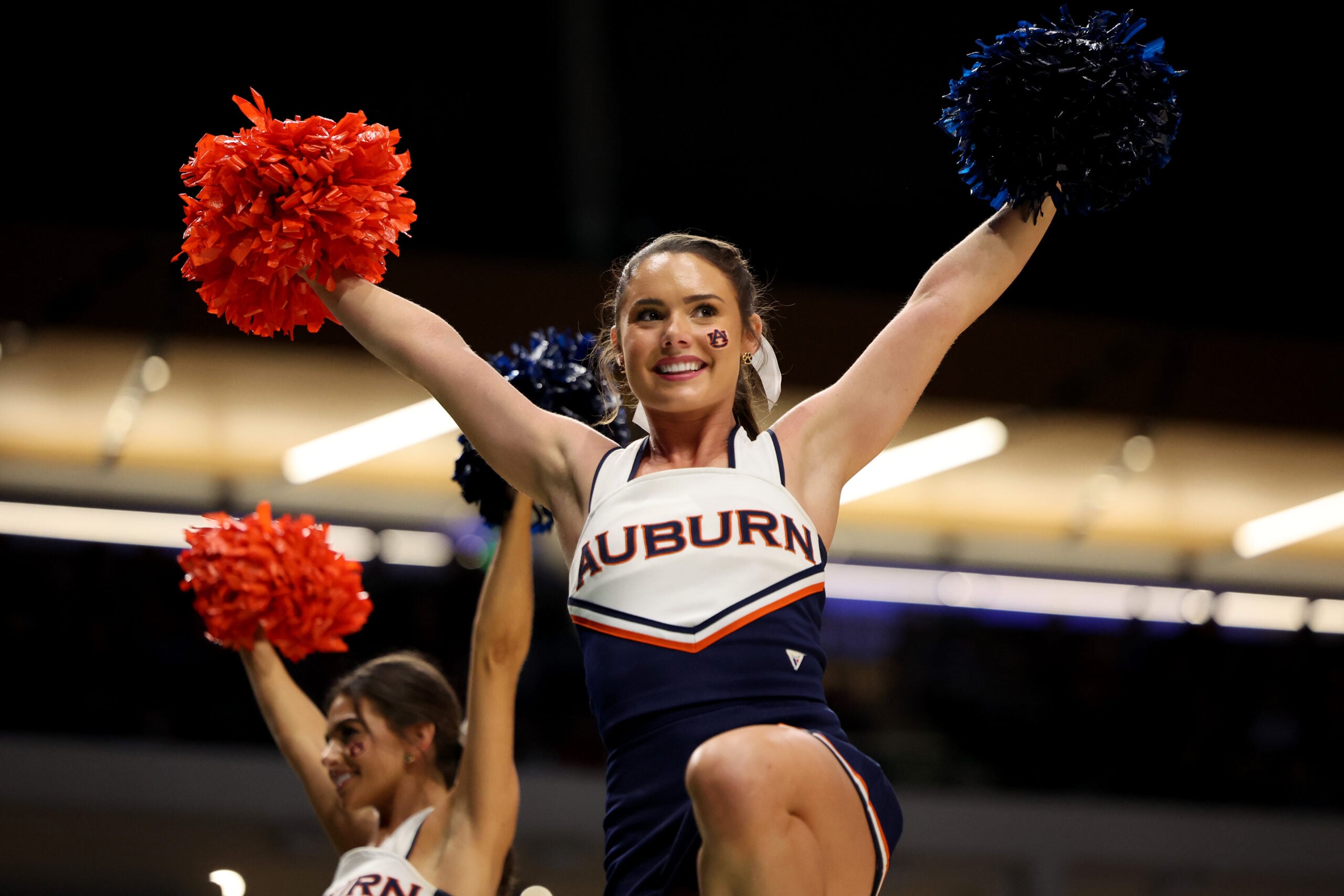 Mar 18, 2023; Birmingham, AL, USA; A cheerleader for the Auburn Tigers during the first half against the Houston Cougars at Legacy Arena. Mandatory Credit: Vasha Hunt-Imagn Images