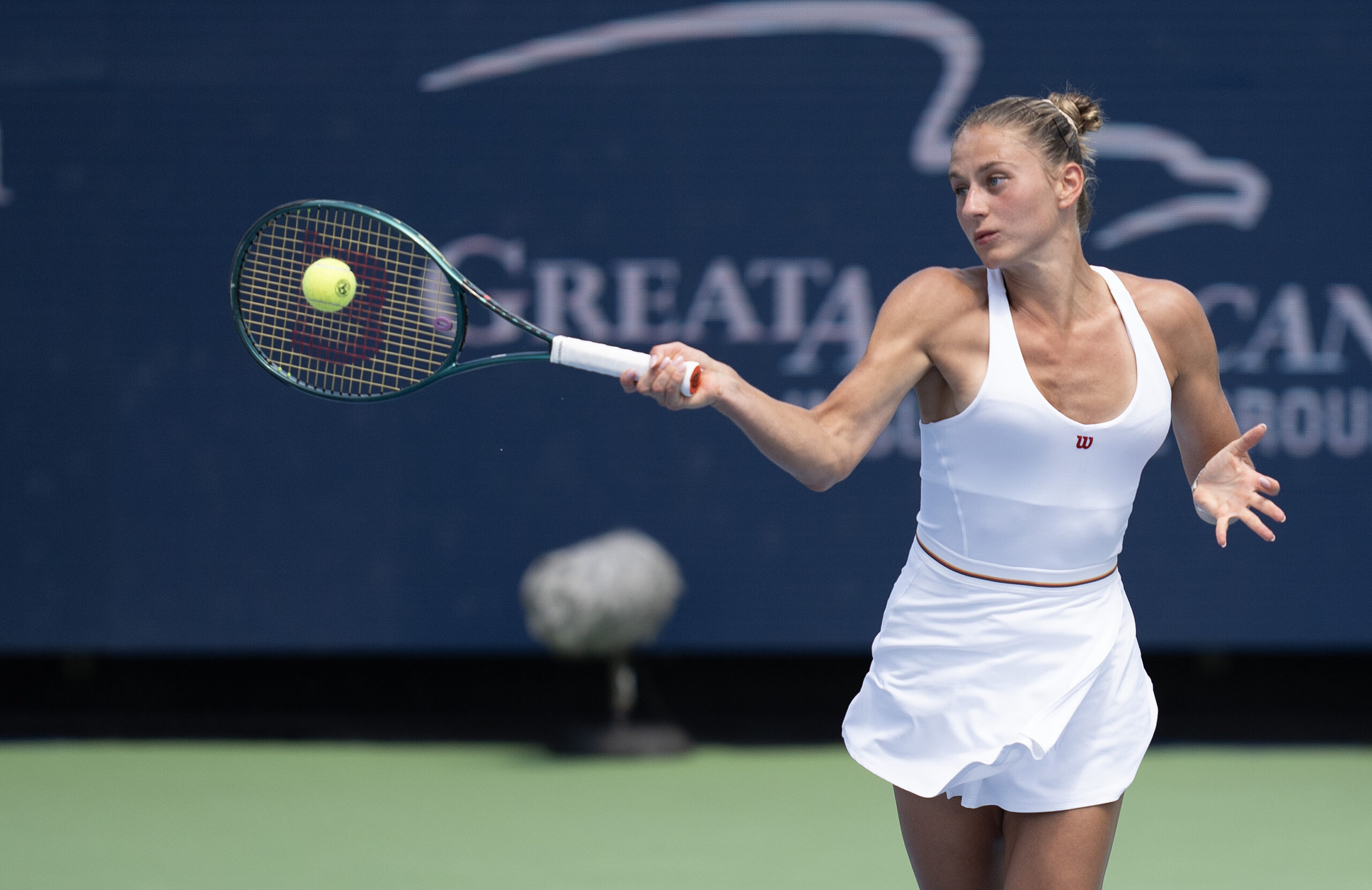 Aug 16, 2024; Cincinnati, OH, USA;  Marta Kostyuk of Ukraine returns a shot during her match against Iga Swiatek of Poland on day five of the Cincinnati Open. Mandatory Credit: Susan Mullane-Imagn Images