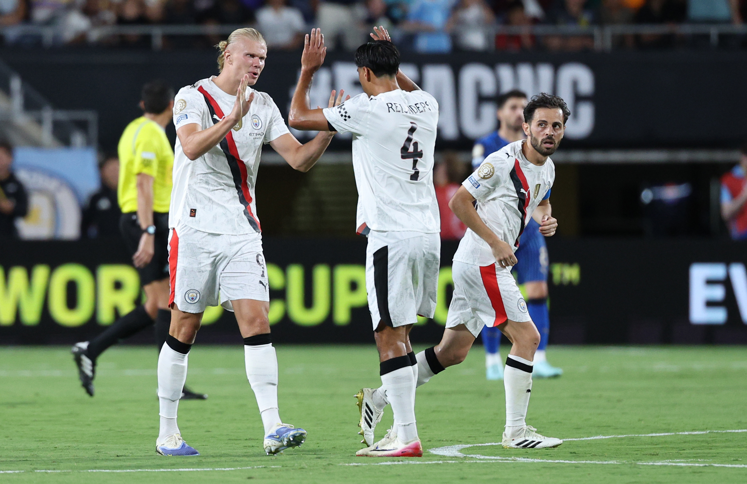 Jun 30, 2025; Orlando, Florida, USA; Manchester City forward Erling Haaland (9) celebrates with midfielder Tijjani Reijnders (4) after scoring in the second half during a round of 16 match of the 2025 FIFA Club World Cup at Camping World Stadium. Mandatory Credit: Nathan Ray Seebeck-Imagn Images