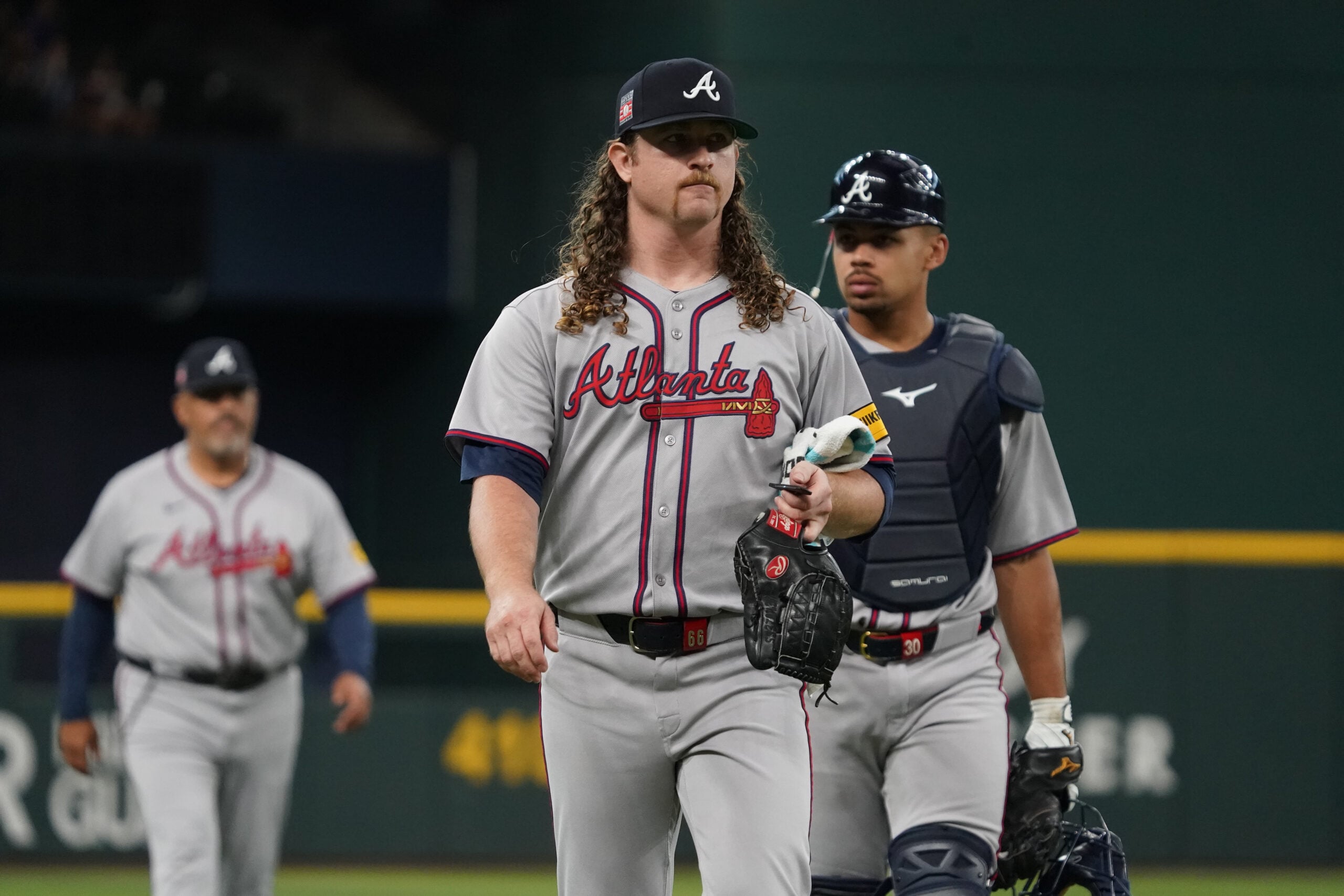 Jul 26, 2025; Arlington, Texas, USA; Atlanta Braves starting pitcher Grant Holmes (66) walks in from the bullpen prior to a game against the Texas Rangers at Globe Life Field. Mandatory Credit: Raymond Carlin III-Imagn Images