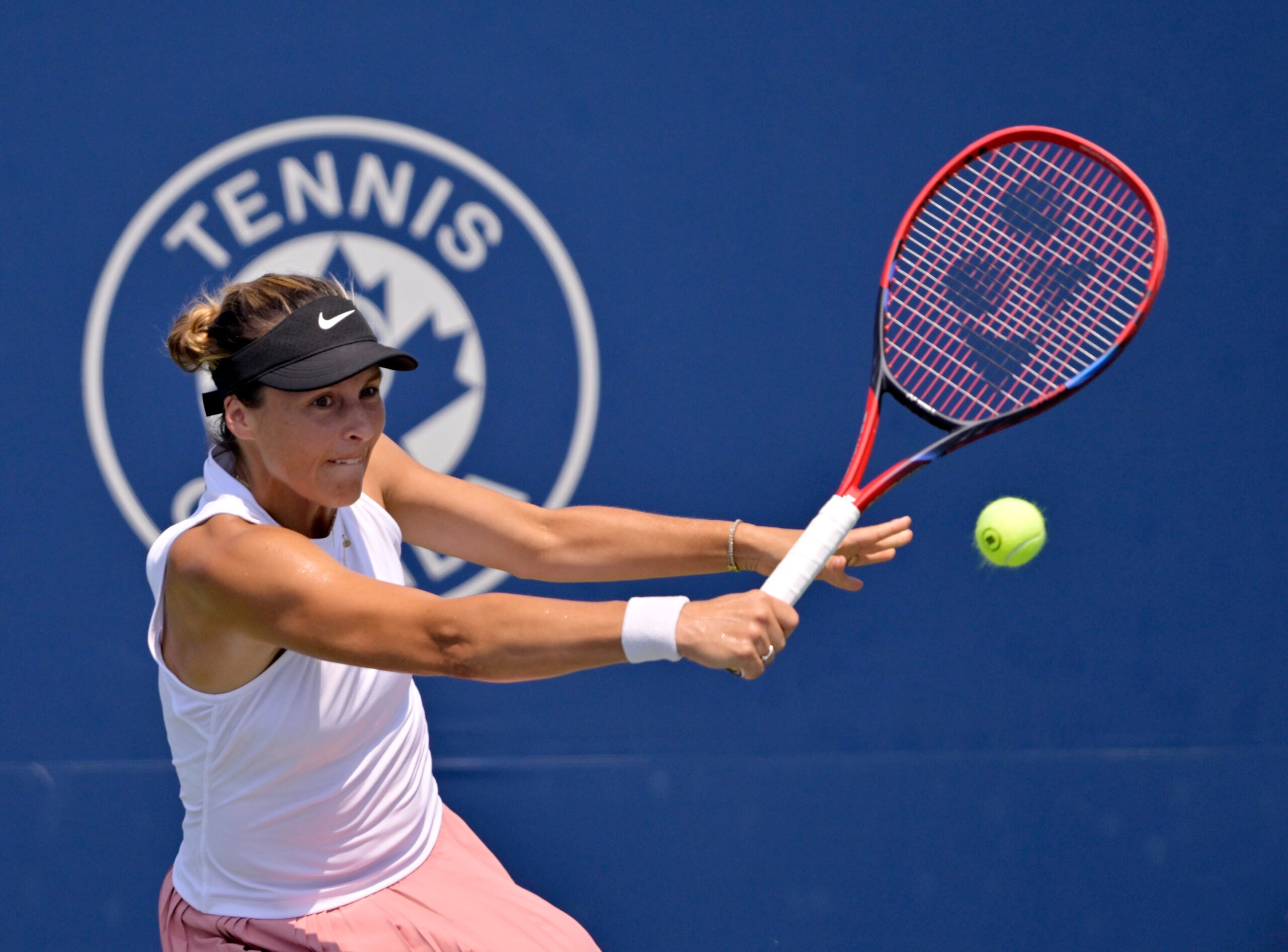 Jul 28, 2025; Montreal, QC, Canada; Tatjana Maria (GER) reacts returns the ball against Laura Siegemund (GER) in first round play at IGA Stadium. Mandatory Credit: Eric Bolte-Imagn Images