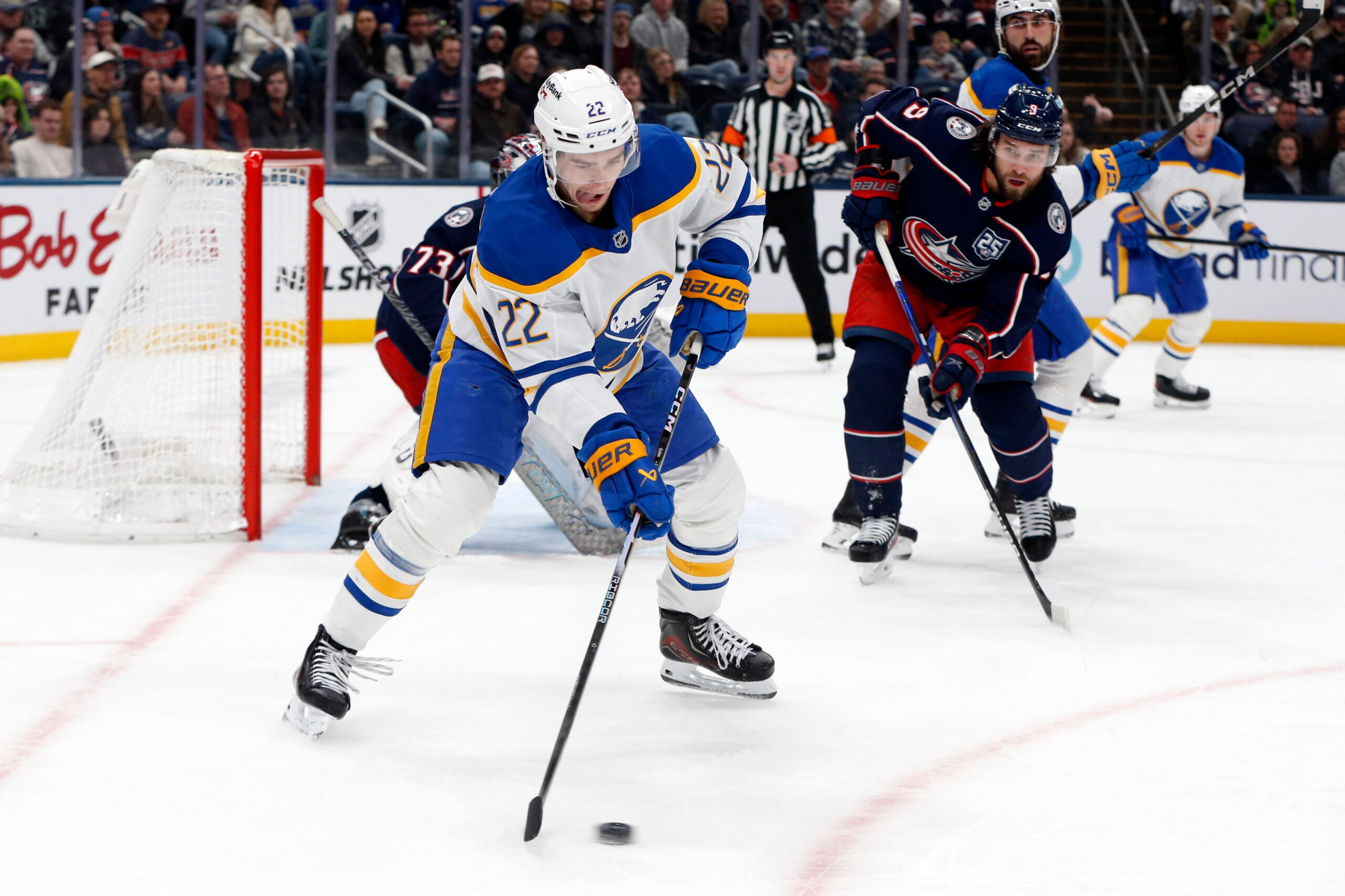Jan 3, 2026; Columbus, Ohio, USA; Buffalo Sabres right wing Jack Quinn (22) receives a pass as Columbus Blue Jackets defenseman Ivan Provorov (9) defends during the first period at Nationwide Arena. Mandatory Credit: Russell LaBounty-Imagn Images