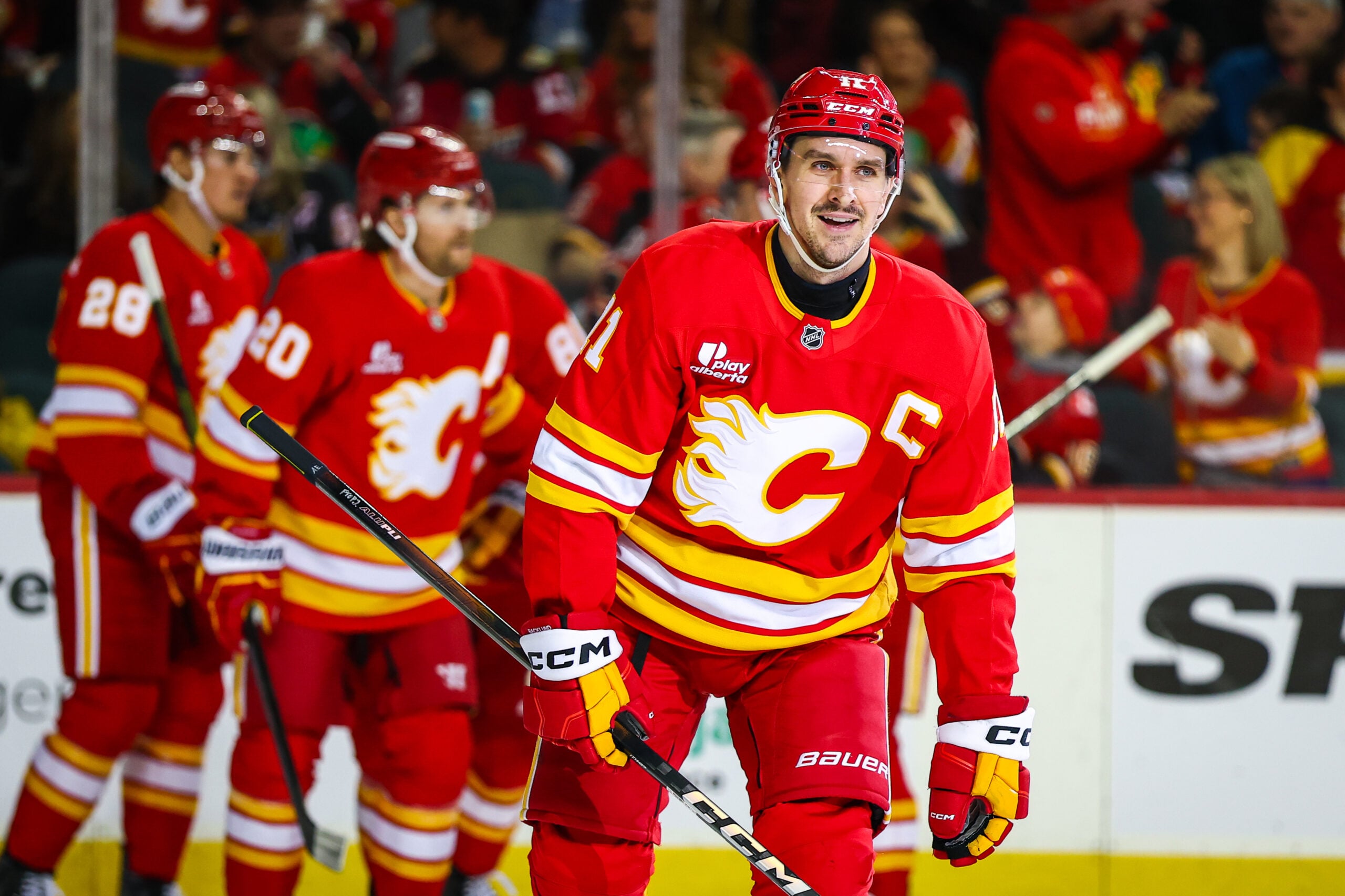 Mar 22, 2026; Calgary, Alberta, CAN; Calgary Flames center Mikael Backlund (11) celebrates his goal with teammates against the Tampa Bay Lightning during the second period at Scotiabank Saddledome. Mandatory Credit: Sergei Belski-Imagn Images