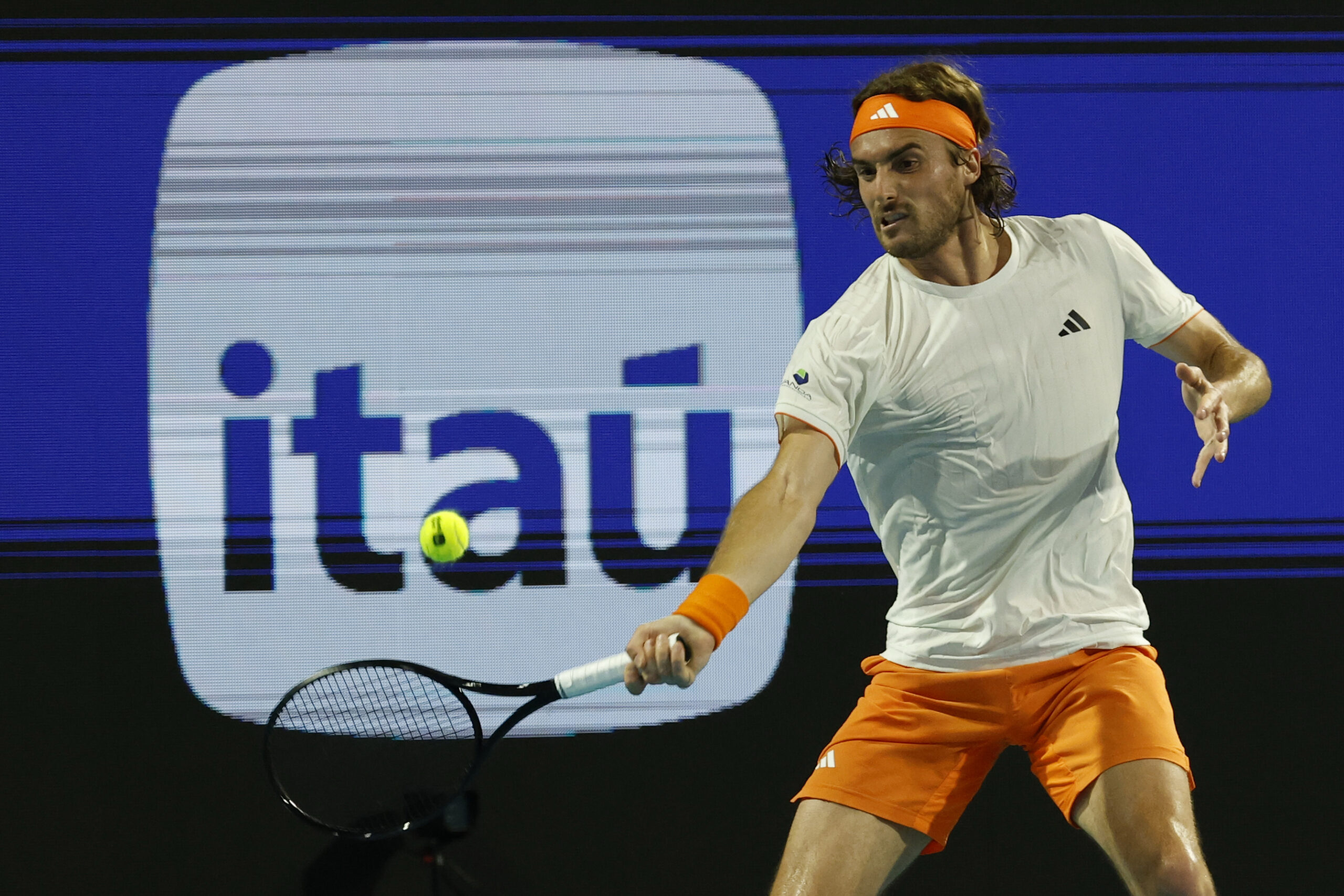 Mar 22, 2026; Miami Gardens, FL, USA; Stefanos Tsitsipas (GRE) hits a forehand against Arthur Fils (FRA) (not pictured) on day six of the 2026 Miami Open at Hard Rock Stadium. Mandatory Credit: Geoff Burke-Imagn Images