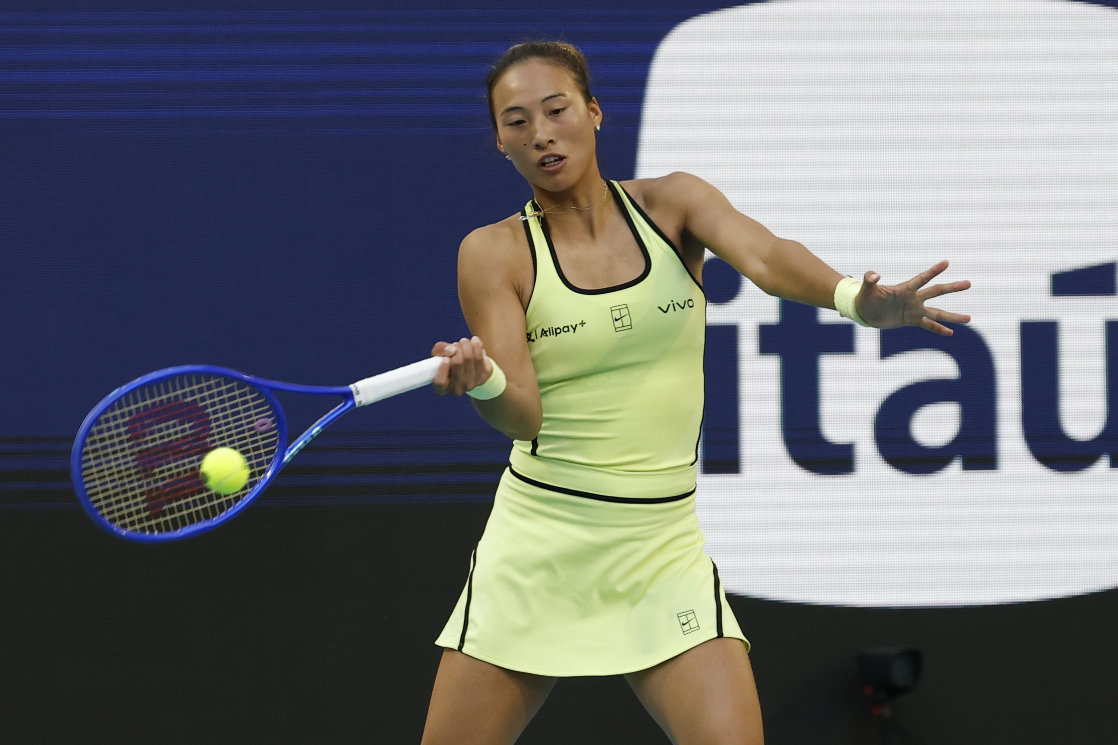 Mar 23, 2026; Miami Gardens, FL, USA; Qinwen Zheng (CHN) hits a forehand against Aryna Sabalenka (not pictured) on day 7 of the 2026 Miami Open at Hard Rock Stadium. Mandatory Credit: Geoff Burke-Imagn Images