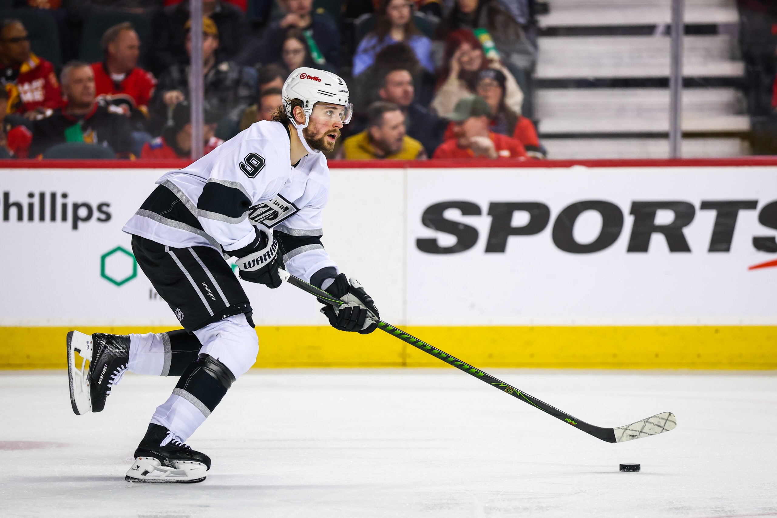 Mar 24, 2026; Calgary, Alberta, CAN; Los Angeles Kings right wing Adrian Kempe (9) skates with the puck against the Calgary Flames during the second period at Scotiabank Saddledome. Mandatory Credit: Sergei Belski-Imagn Images