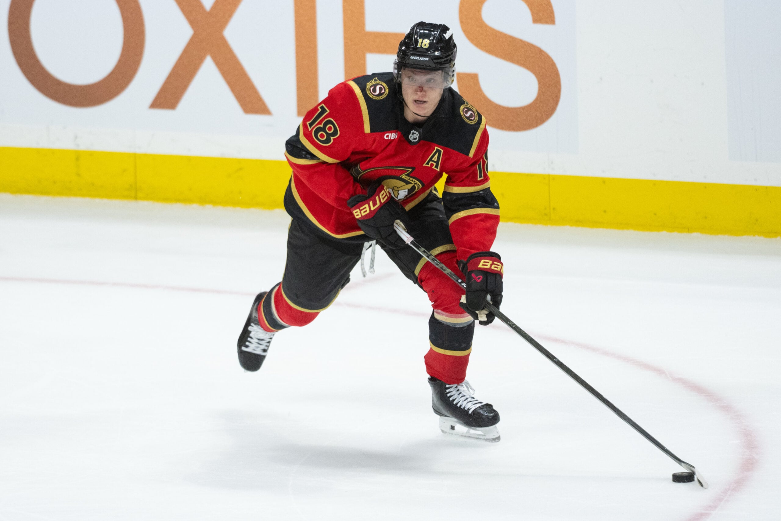 Mar 26, 2026; Ottawa, Ontario, CAN; Ottawa Senators center Tim Stutzle (18) moves the puck in overtime against the Pittsburgh Penguins at the Canadian Tire Centre. Mandatory Credit: Marc DesRosiers-IMAGN Images