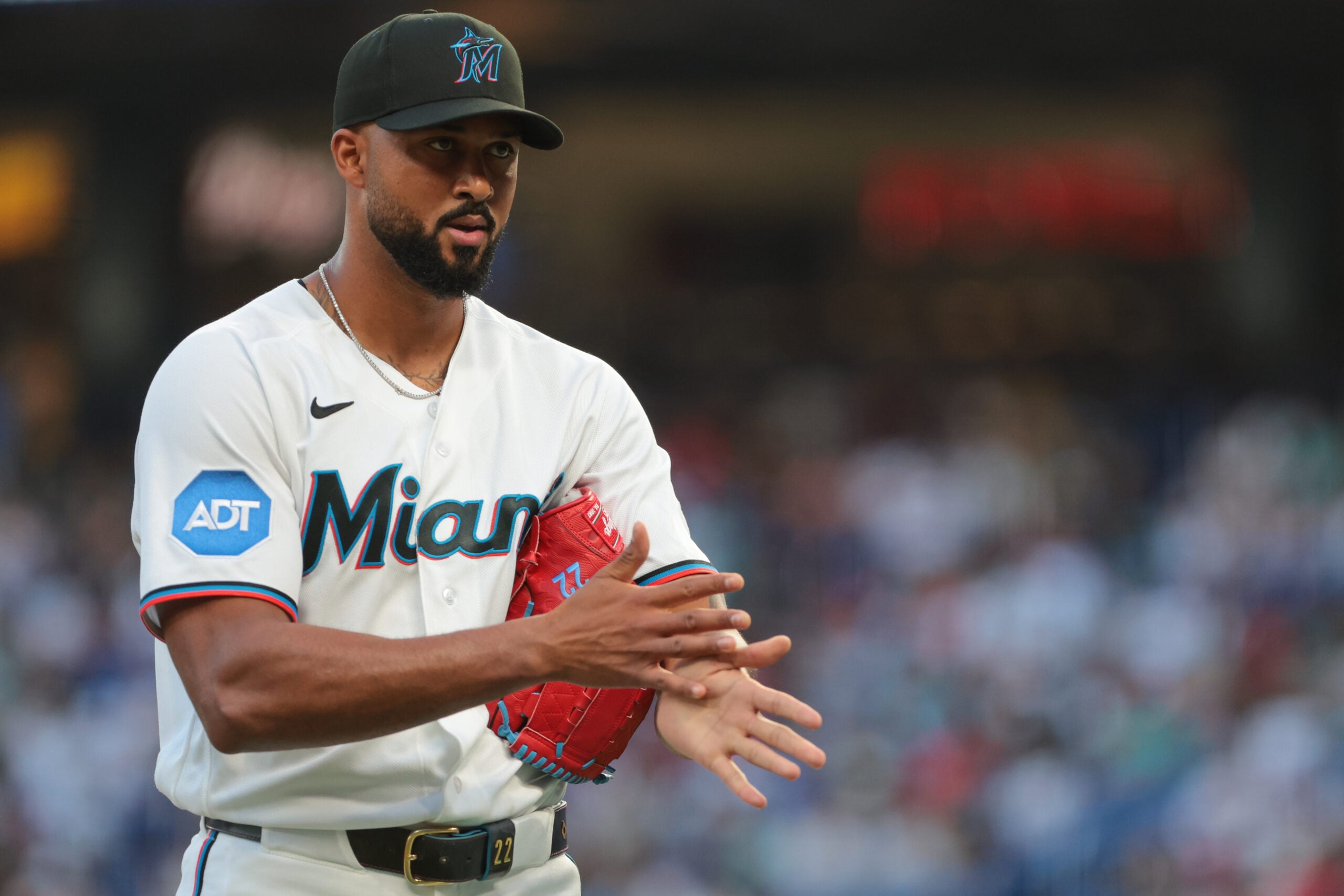 Mar 27, 2026; Miami, Florida, USA; Miami Marlins starting pitcher Sandy Alcantara (22) returns to the dugout against the Colorado Rockies during the first inning at loanDepot Park. Mandatory Credit: Sam Navarro-Imagn Images