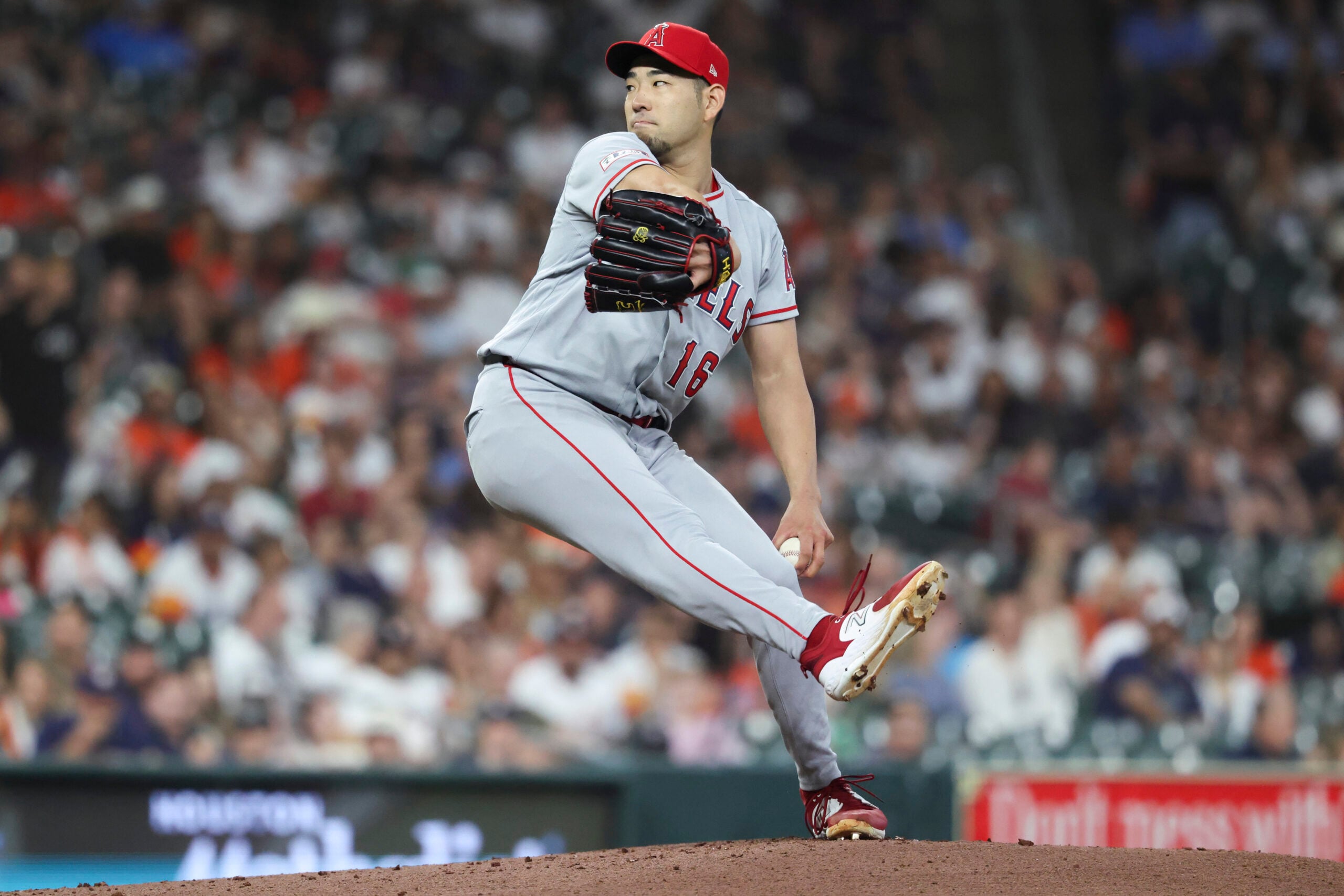 Mar 27, 2026; Houston, Texas, USA; Los Angeles Angels starting pitcher Yusei Kikuchi (16) delivers a pitch during the first inning against the Houston Astros at Daikin Park. Mandatory Credit: Troy Taormina-Imagn Images