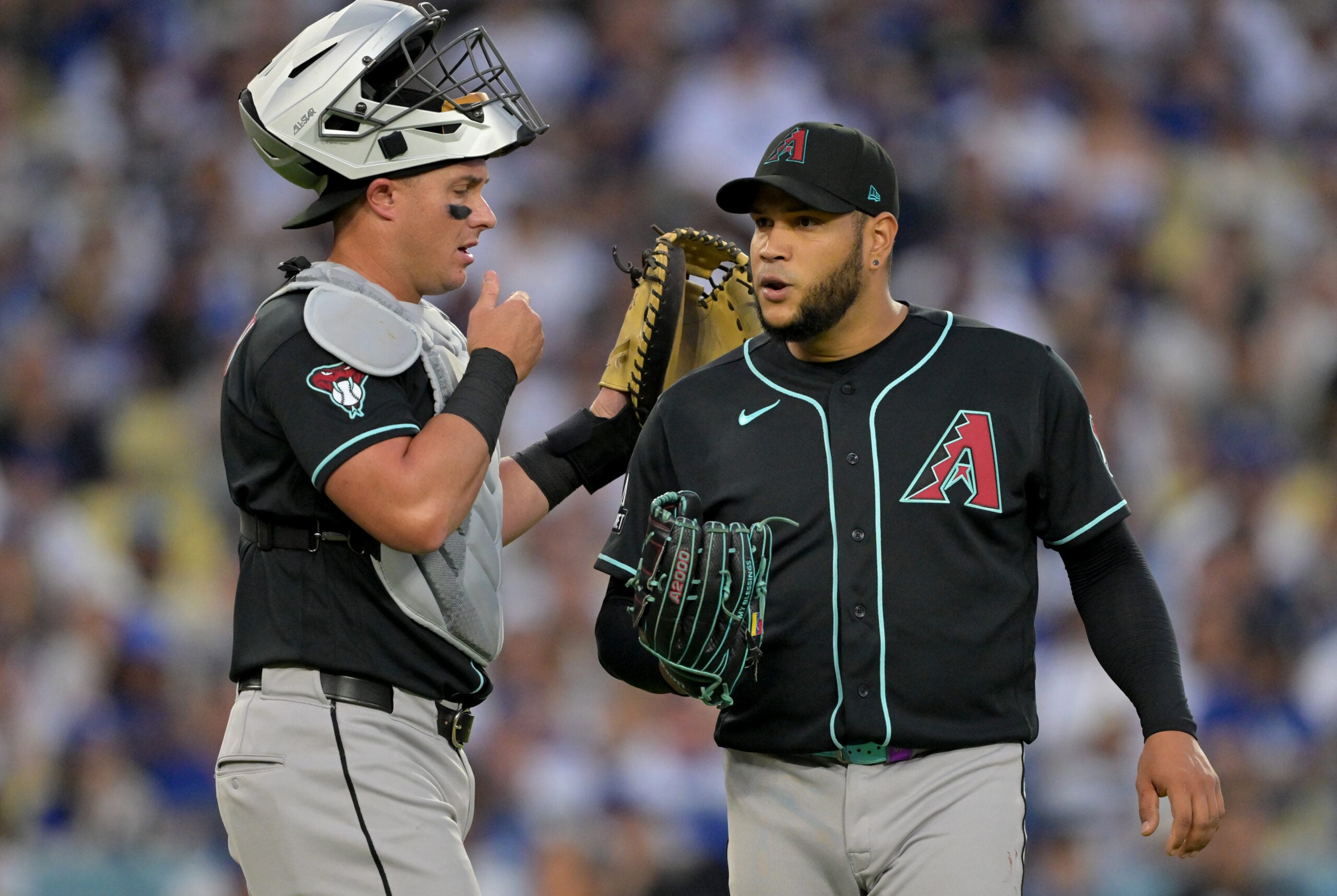 Mar 28, 2026; Los Angeles, California, USA; Arizona Diamondbacks catcher James McCann (8) talks to pitcher Eduardo Rodriguez (57) during the third inning against the Los Angeles Dodgers at Dodger Stadium. Mandatory Credit: Jayne Kamin-Oncea-Imagn Images