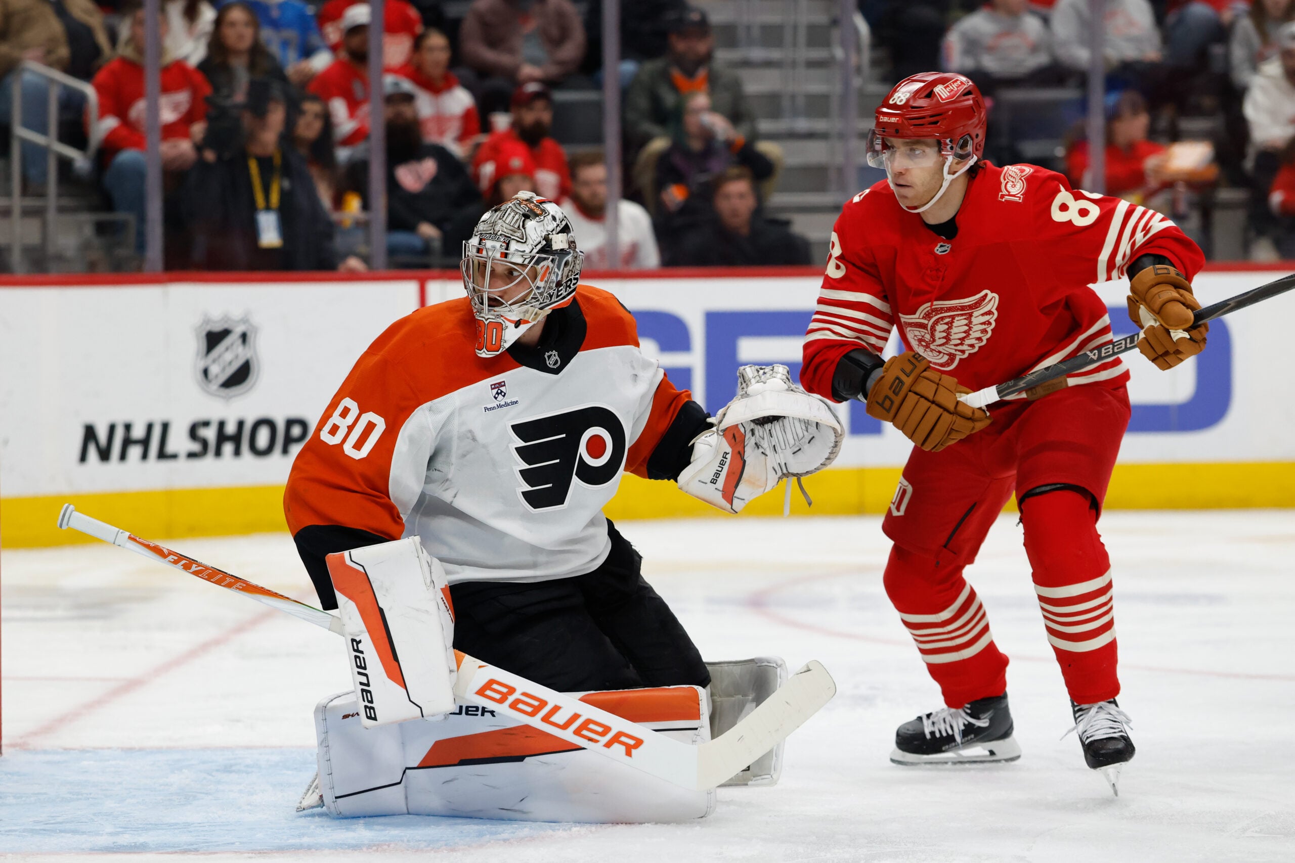 Mar 28, 2026; Detroit, Michigan, USA;  Philadelphia Flyers goaltender Dan Vladar (80) makes a save in front of Detroit Red Wings right wing Patrick Kane (88) in the second period at Little Caesars Arena. Mandatory Credit: Rick Osentoski-Imagn Images