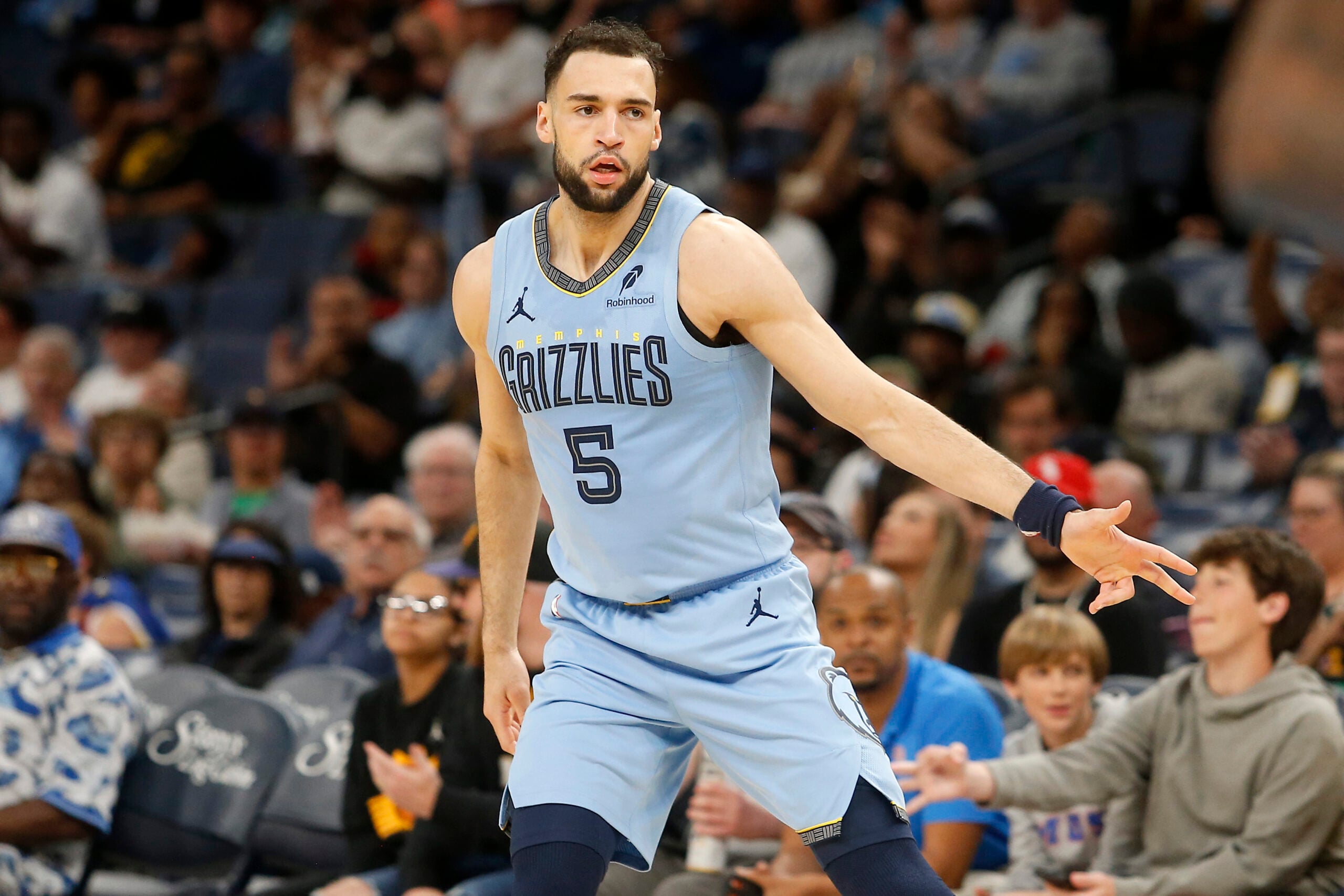 Mar 30, 2026; Memphis, Tennessee, USA; Memphis Grizzlies forward Tyler Burton (5) reacts during the third quarter against the Phoenix Suns at FedExForum. Mandatory Credit: Petre Thomas-Imagn Images