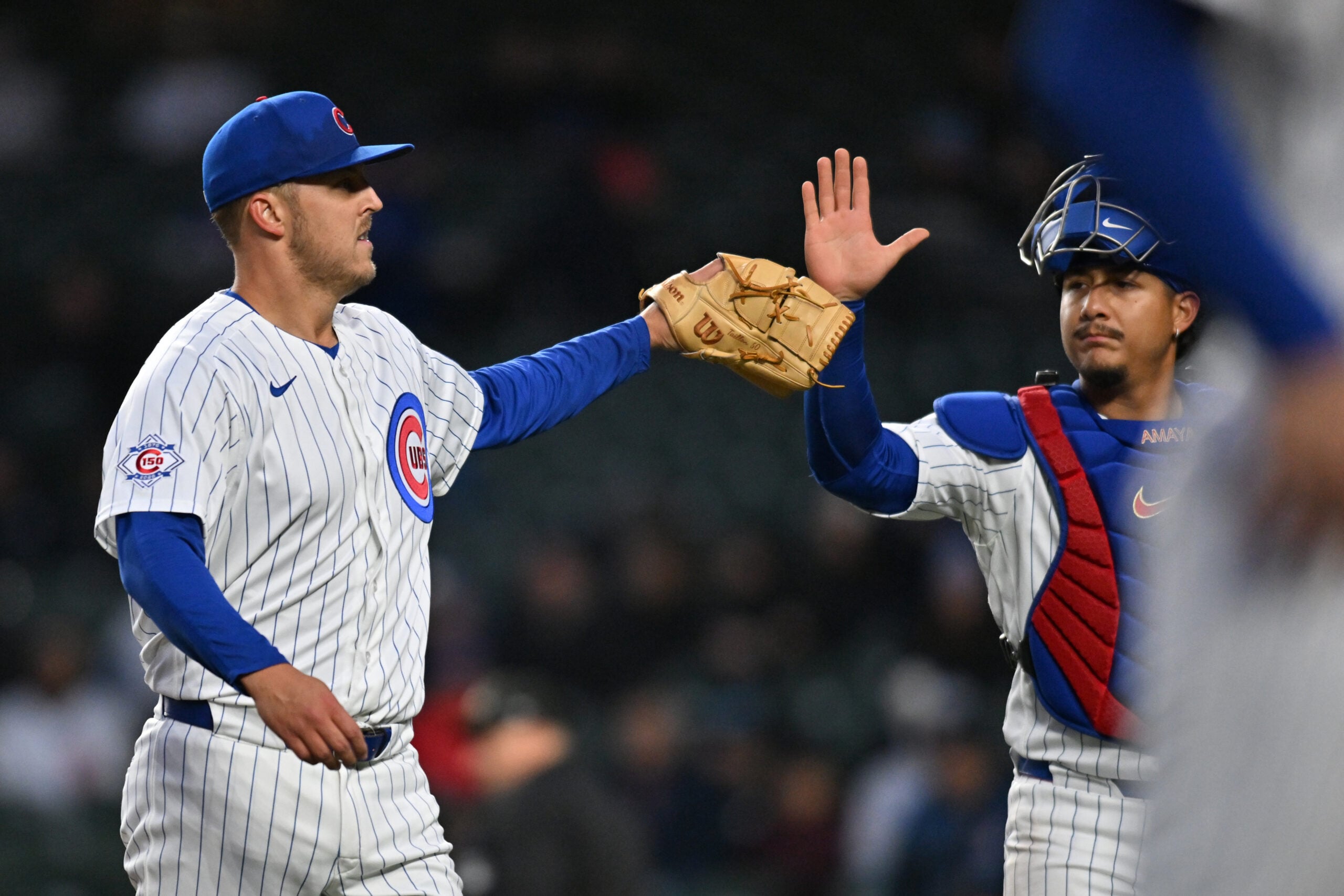 Mar 31, 2026; Chicago, Illinois, USA; Chicago Cubs pitcher Jameson Taillon (50) and catcher Miguel Amaya (9) celebrate after ending the top of the first inning against the Los Angeles Angels at Wrigley Field. Mandatory Credit: Patrick Gorski-Imagn Images