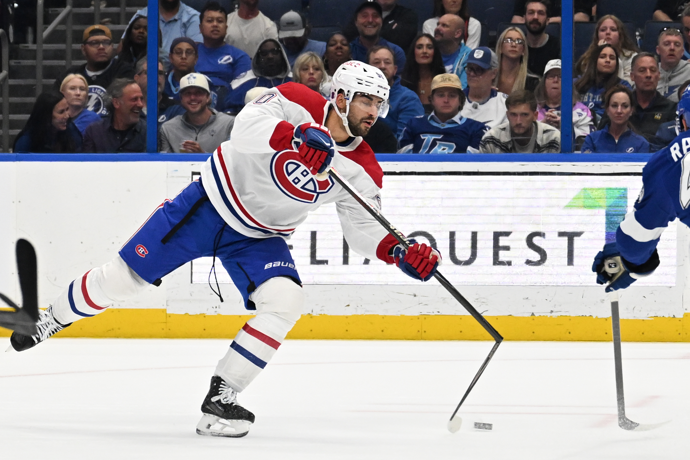 Mar 31, 2026; Tampa, Florida, USA;  Montreal Canadian center Joe Veleno (90) takes a shot on goal in the second period against the Tampa Bay Lightning at Benchmark International Arena. Mandatory Credit: Jonathan Dyer-Imagn Images