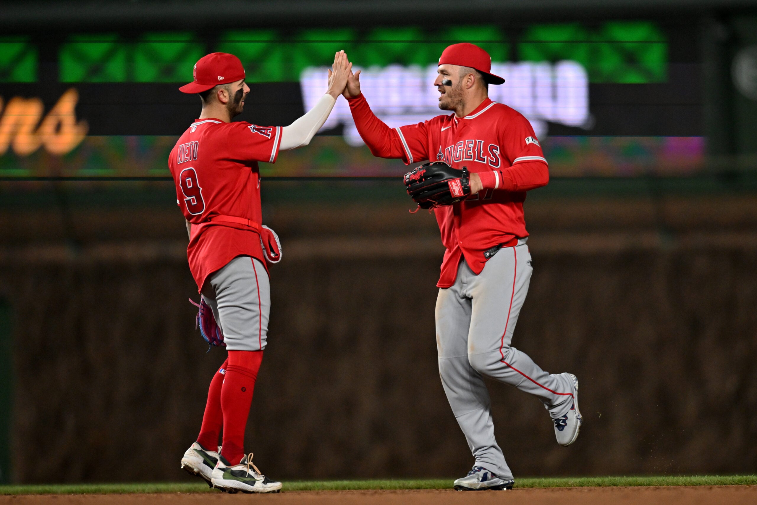 Mar 31, 2026; Chicago, Illinois, USA; Los Angeles Angels center fielder Mike Trout (27) celebrates his team’s victory over the Chicago Cubs with shortstop Zach Neto (9) at Wrigley Field. Mandatory Credit: Patrick Gorski-Imagn Images
