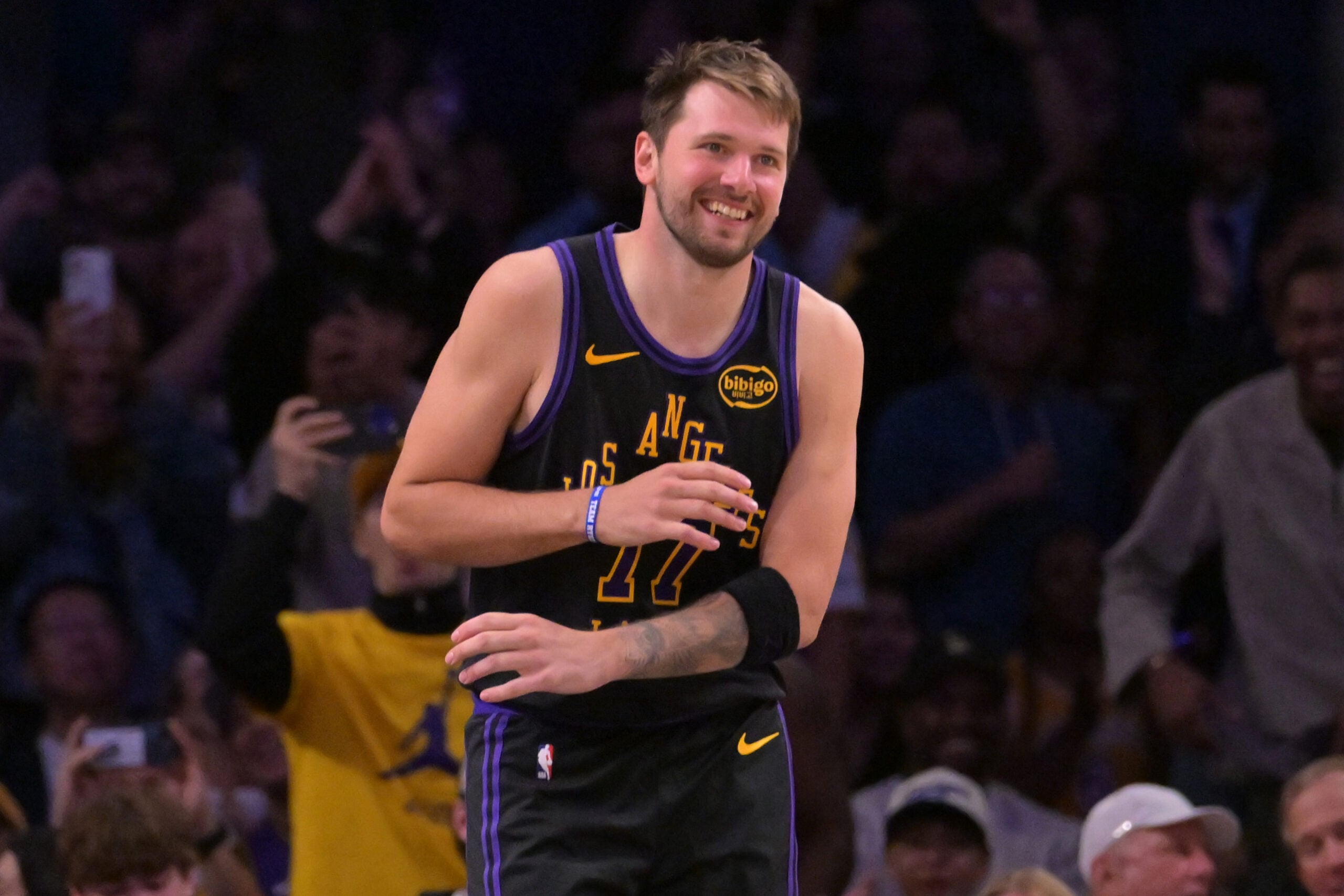 Mar 31, 2026; Los Angeles, California, USA;  Los Angeles Lakers guard Luka Doncic (77) smiles after a dunk in the final minutes of the game against the Cleveland Cavaliers at Crypto.com Arena. Mandatory Credit: Jayne Kamin-Oncea-Imagn Images