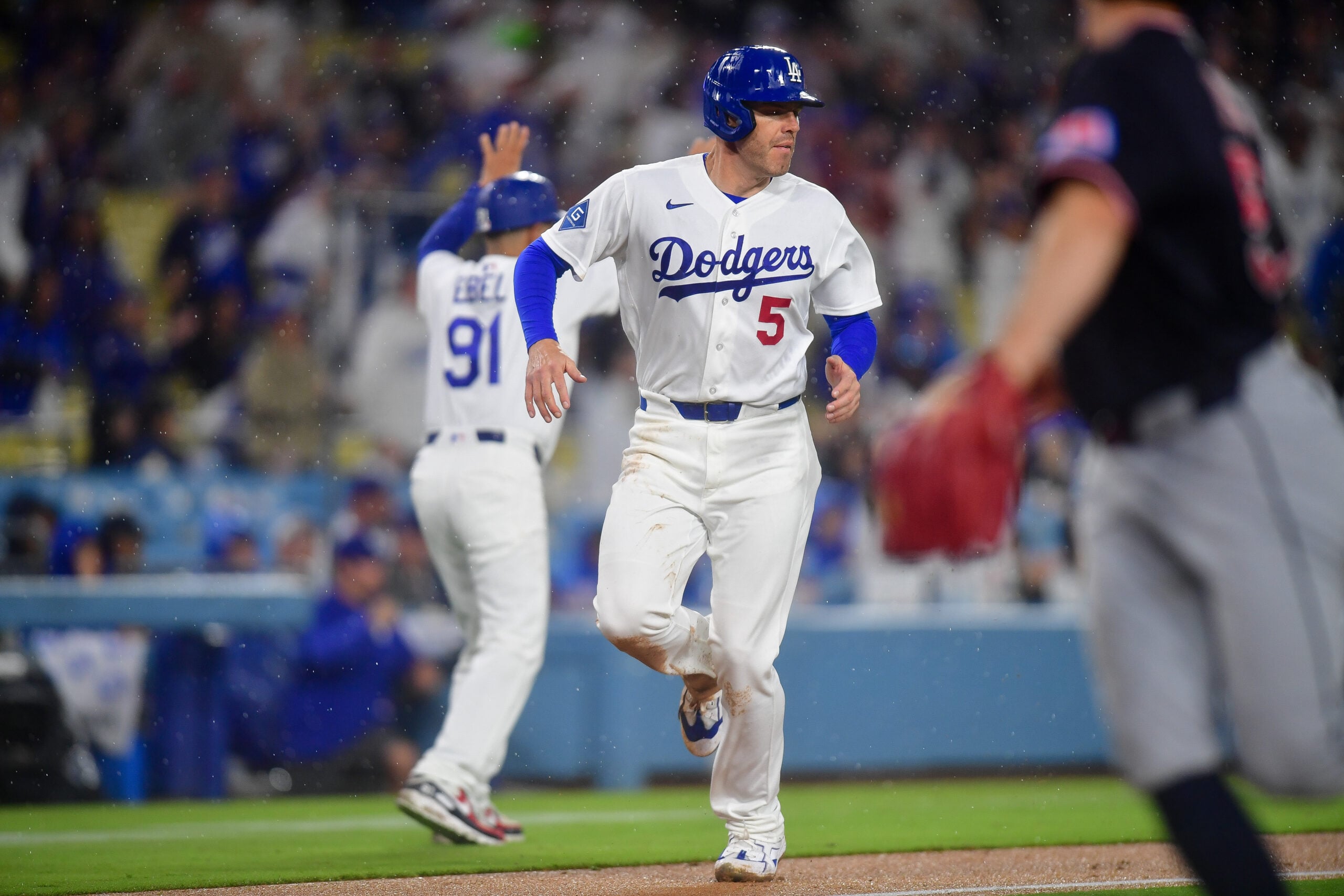 Mar 31, 2026; Los Angeles, California, USA; Los Angeles Dodgers first baseman Freddie Freeman (5) runs home to score against the Cleveland Guardians during the eighth inning at Dodger Stadium. Mandatory Credit: Gary A. Vasquez-Imagn Images