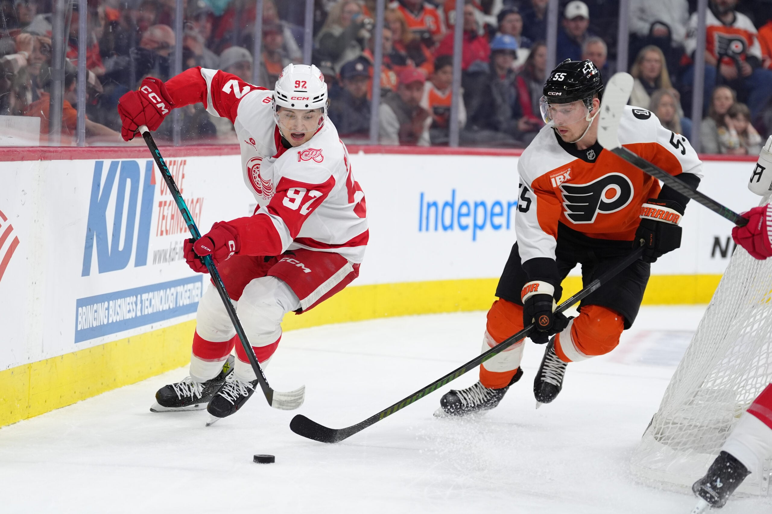 Apr 2, 2026; Philadelphia, Pennsylvania, USA; Detroit Red Wings center Marco Kasper (92) battles for the puck against Philadelphia Flyers defenseman Rasmus Ristolainen (55) in the first period at Xfinity Mobile Arena. Mandatory Credit: Kyle Ross-Imagn Images
