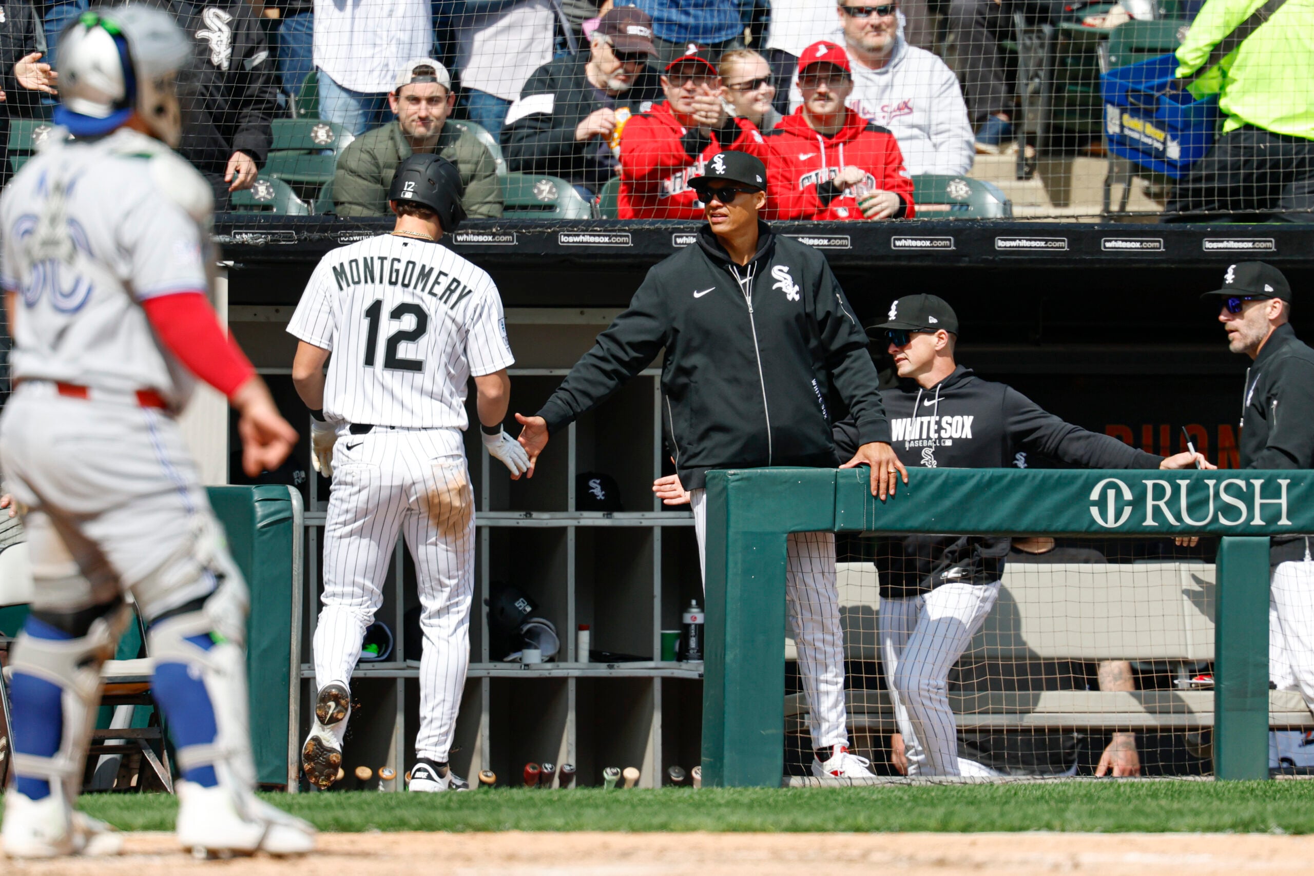 Apr 3, 2026; Chicago, Illinois, USA; Chicago White Sox manager Will Venable congratulates shortstop Colson Montgomery (12) after he scored against the Toronto Blue Jays during the third inning at Rate Field. Mandatory Credit: Kamil Krzaczynski-Imagn Images