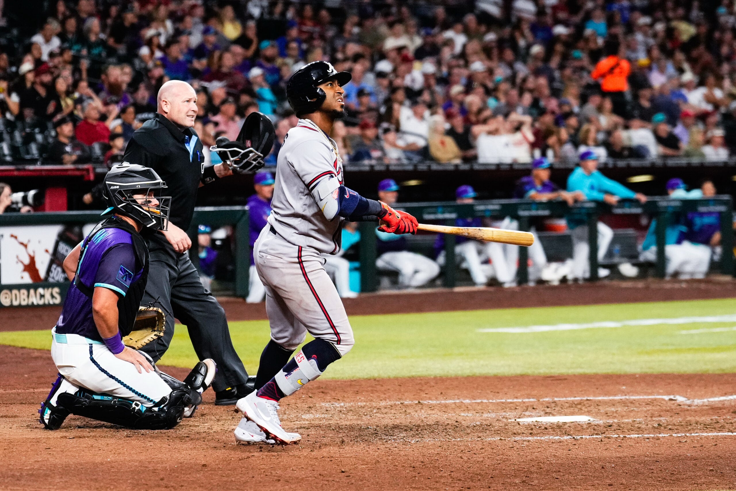 Apr 3, 2026; Phoenix, Arizona, USA; Atlanta Braves second baseman Ozzie Albies (1) hits a solo home run during the ninth inning of the game against the Atlanta Braves at Chase Field. Mandatory Credit: Arianna Grainey-Imagn Images