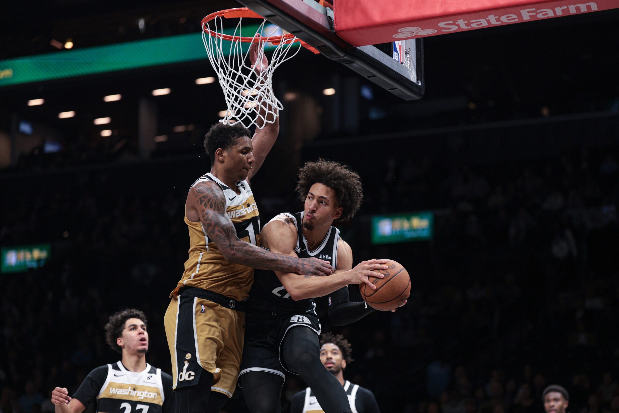Apr 5, 2026; Brooklyn, New York, USA; Brooklyn Nets forward Jalen Wilson (22) looks to pass as Washington Wizards forward Julian Reese (15) defends during the second half at Barclays Center. Mandatory Credit: Vincent Carchietta-Imagn Images