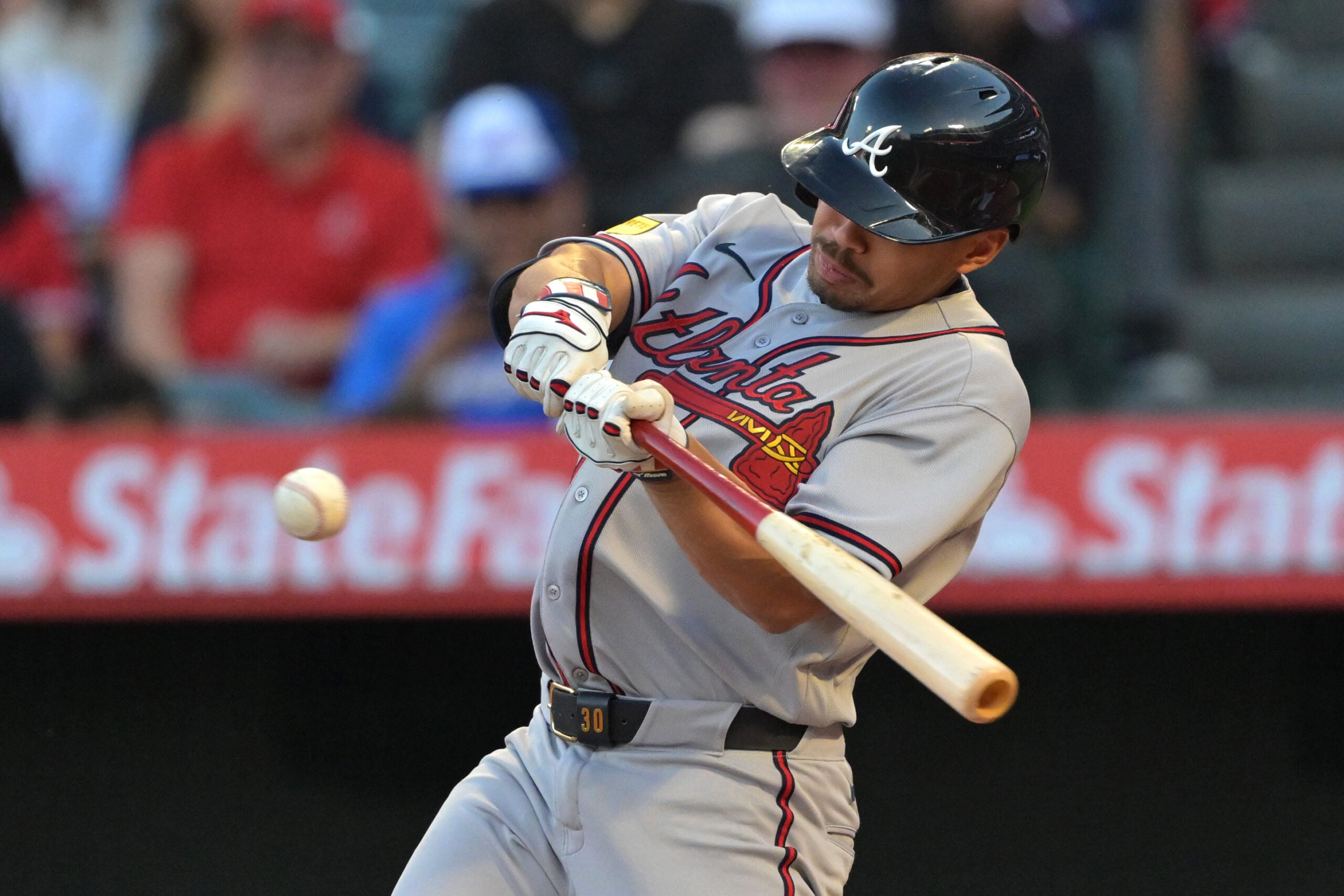 Apr 6, 2026; Anaheim, California, USA; Atlanta Braves catcher Drake Baldwin (30) hits a solo home run in the first inning against the Los Angeles Angels at Angel Stadium. Mandatory Credit: Jayne Kamin-Oncea-Imagn Images