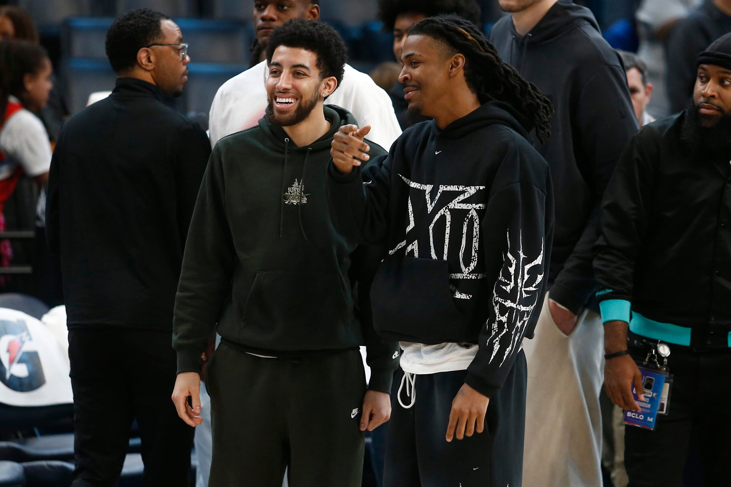 Apr 6, 2026; Memphis, Tennessee, USA; Memphis Grizzlies guard Scotty Pippen Jr. (left) and guard Ja Morant (right) talk after the game against the Cleveland Cavaliers at FedExForum. Mandatory Credit: Petre Thomas-Imagn Images